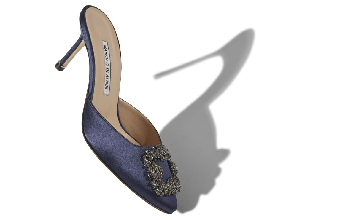 Genevieve Dawn Blue Jewel Buckle Mules – front three-quarter view showing blue jewel buckle, crystal buckle, almond toe…