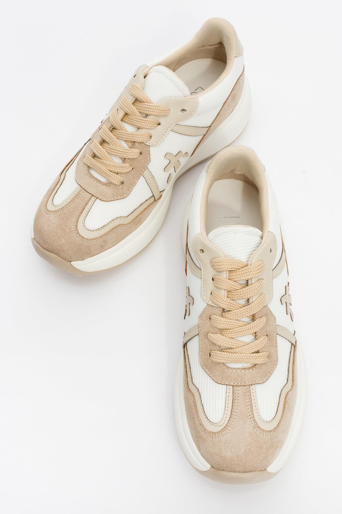Nolton - Beige-White Sneaker – side view showing leather, white, Vowalisse