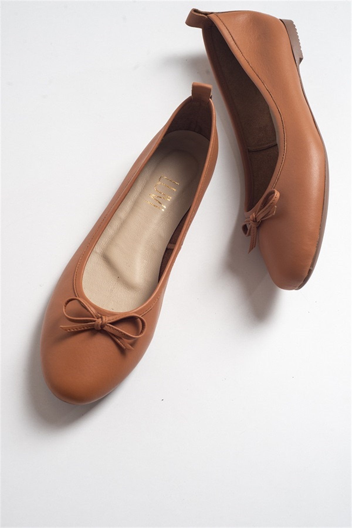 Florence - Cognac Brown Leather Ballerina Flats – front three-quarter view showing bow, leather, suede, Vowalisse