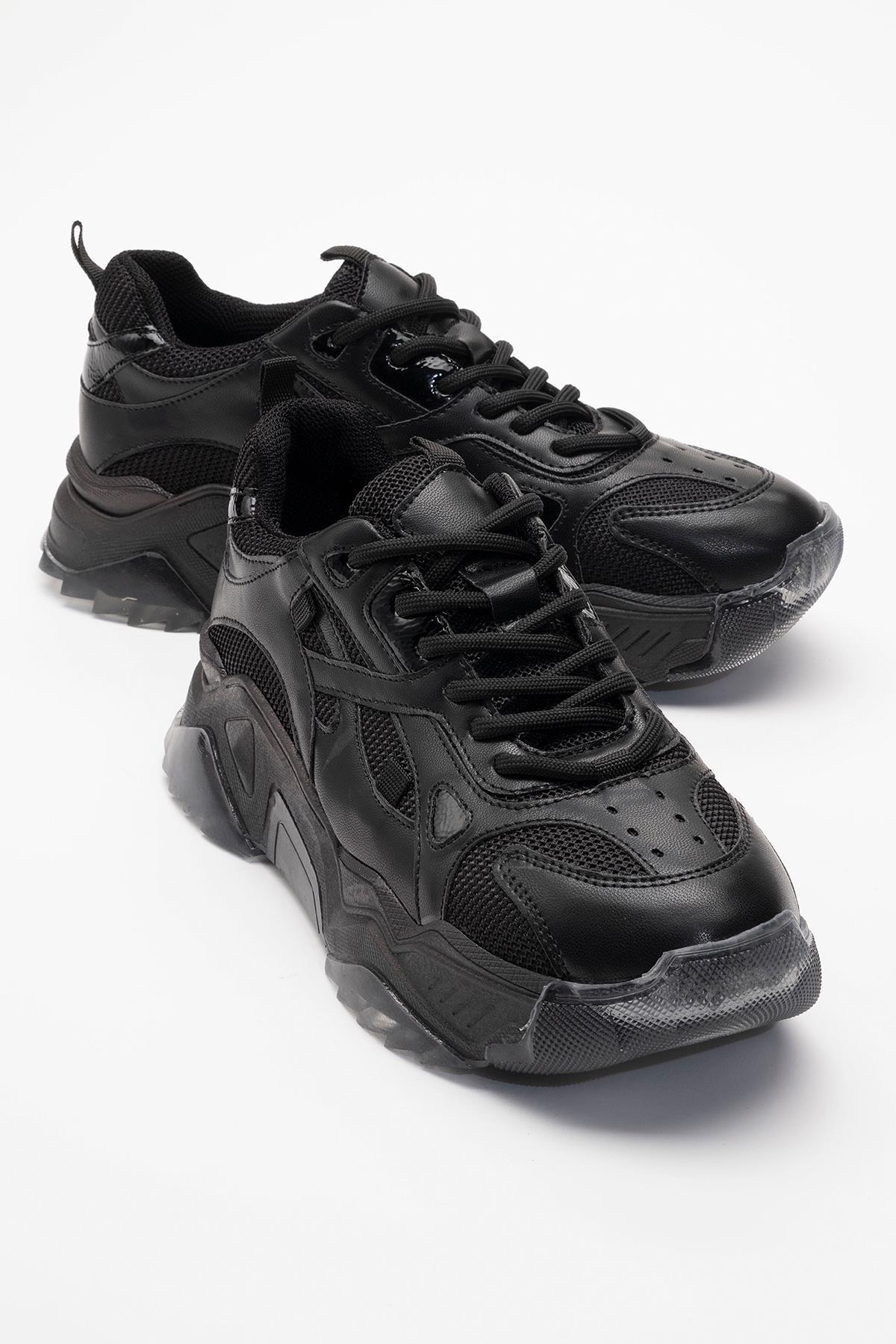 Loretta - Black Sneaker – front three-quarter view showing leather, black, Vowalisse