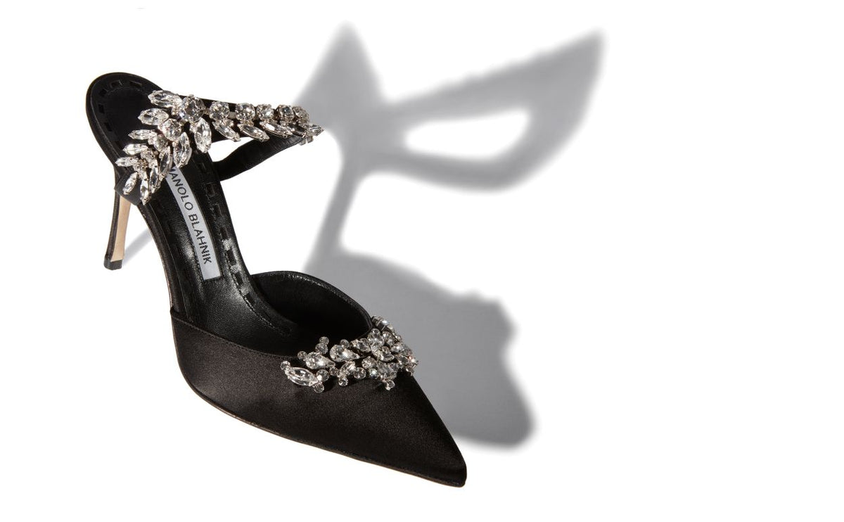 Marcella Bloom Black Crystal Embellished Mules – front three-quarter view showing black crystal embellished, pointed toe…
