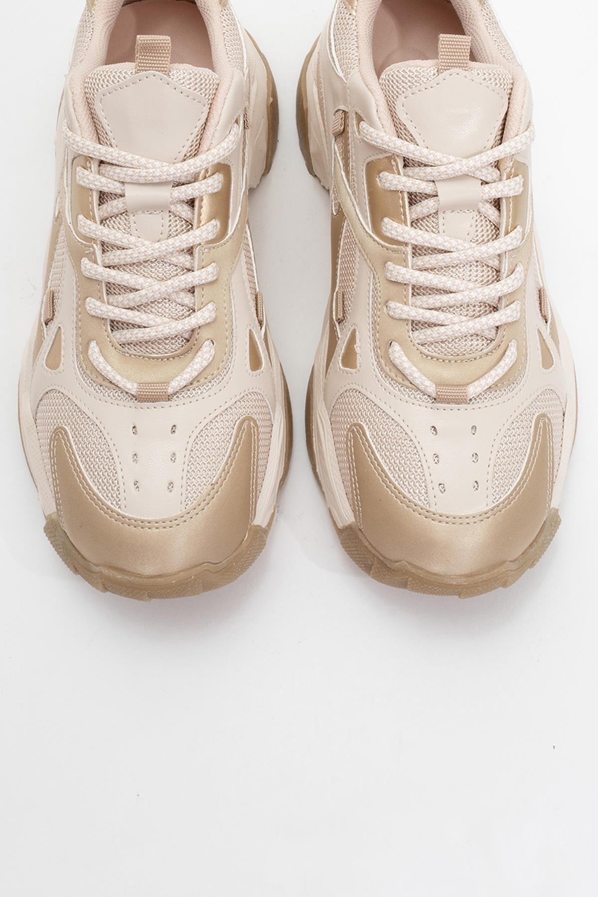 Loretta - Beige Gold Thick-Soled Sneaker – side view showing leather, gold, Vowalisse