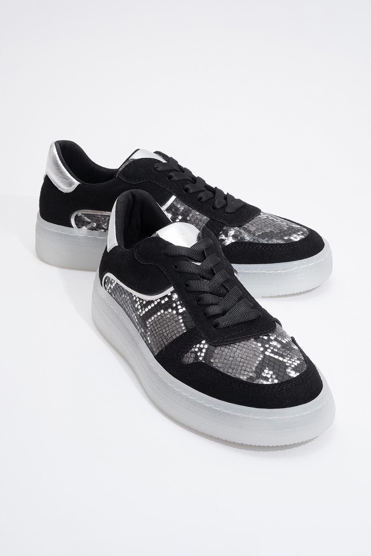 Montero - Black Patterned Sneaker – front three-quarter view showing leather, black, Vowalisse