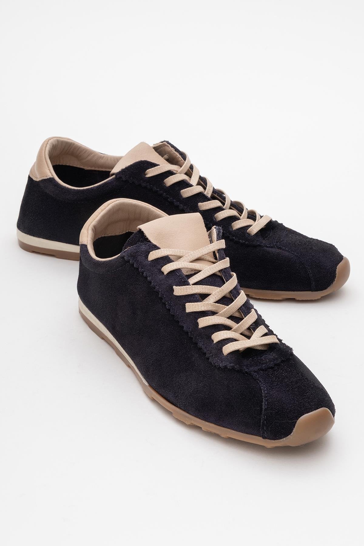 Crea - Navy Leather Sneakers – front three-quarter view showing leather, red, Vowalisse