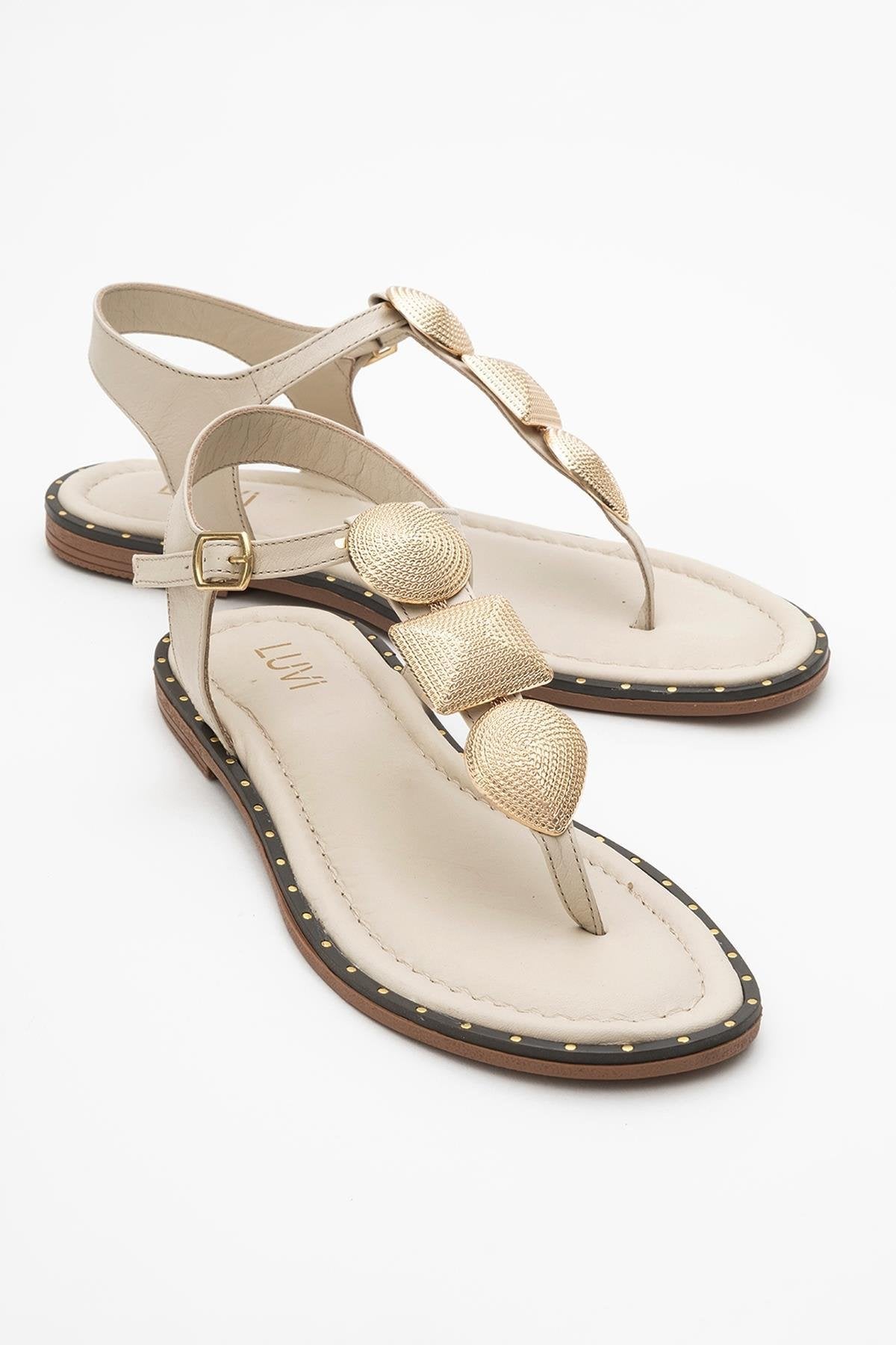 Giulia - Beige Leather Flat Sandal – front three-quarter view showing leather, gold, Vowalisse