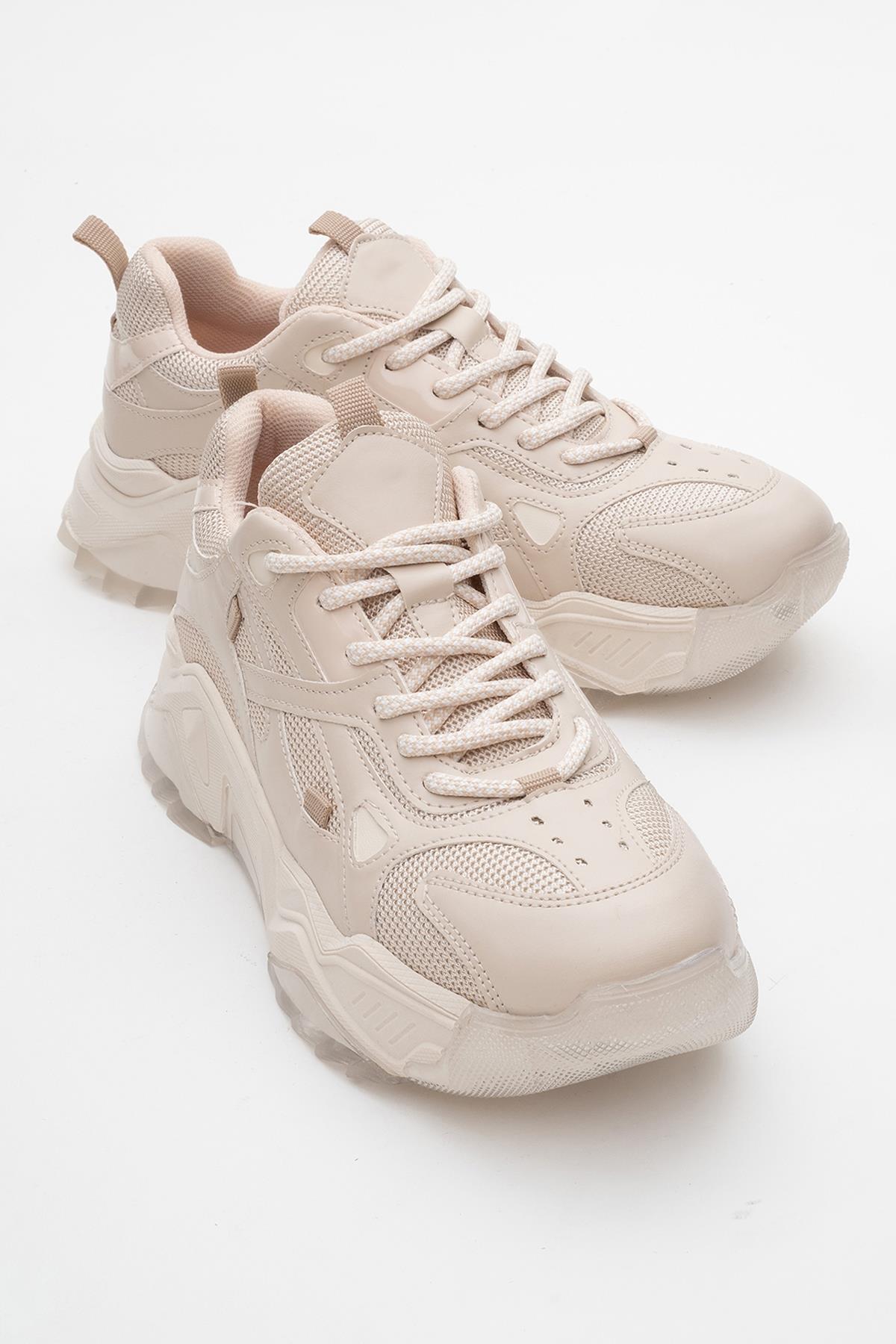 Loretta - Beige Sneaker – front three-quarter view showing leather, Vowalisse