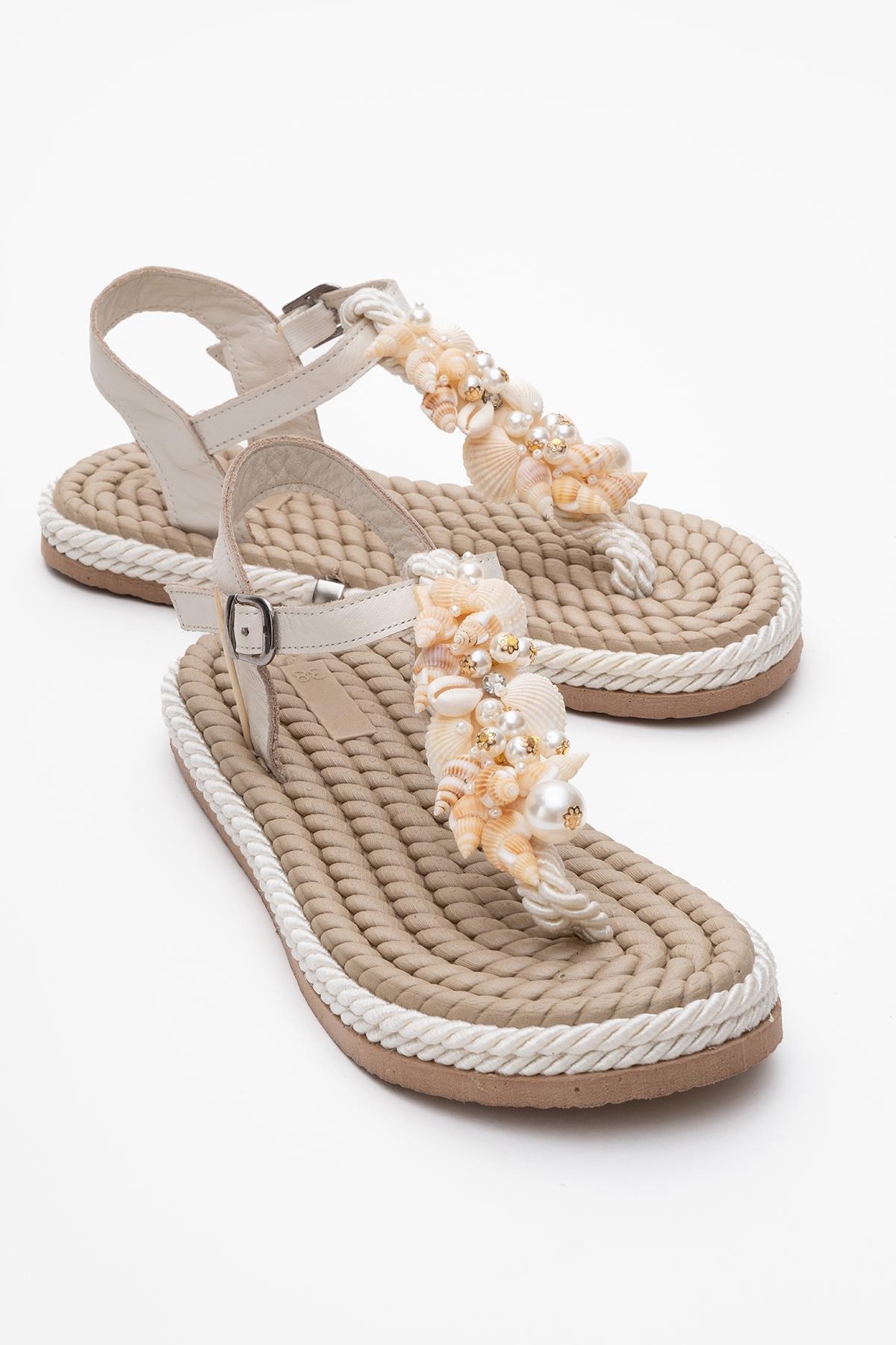 Lely Beige Leather Thong Sandal – front three-quarter view showing lace, leather, red, Vowalisse