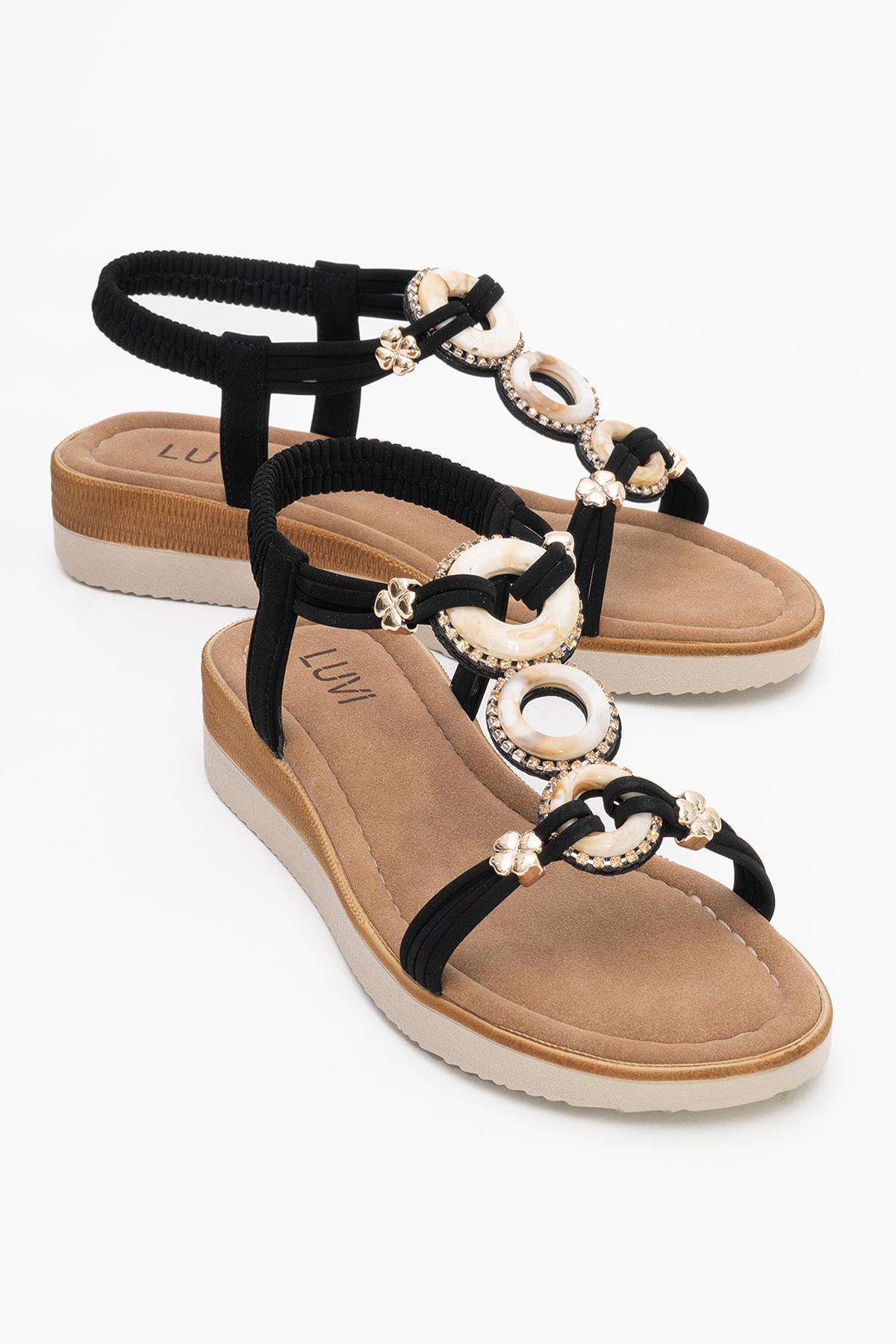 JUNES Black Buckle-Embellished Flat Sandal – front three-quarter view showing crystal, leather, black, Vowalisse