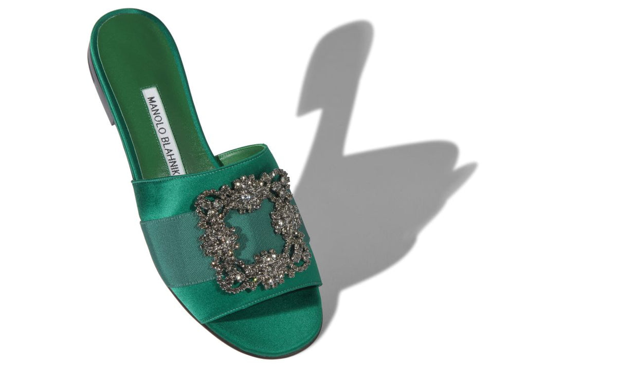 Noelle Muse Green Jewel Buckle Mules – front three-quarter view showing green jewel buckle, crystal buckle, satin…