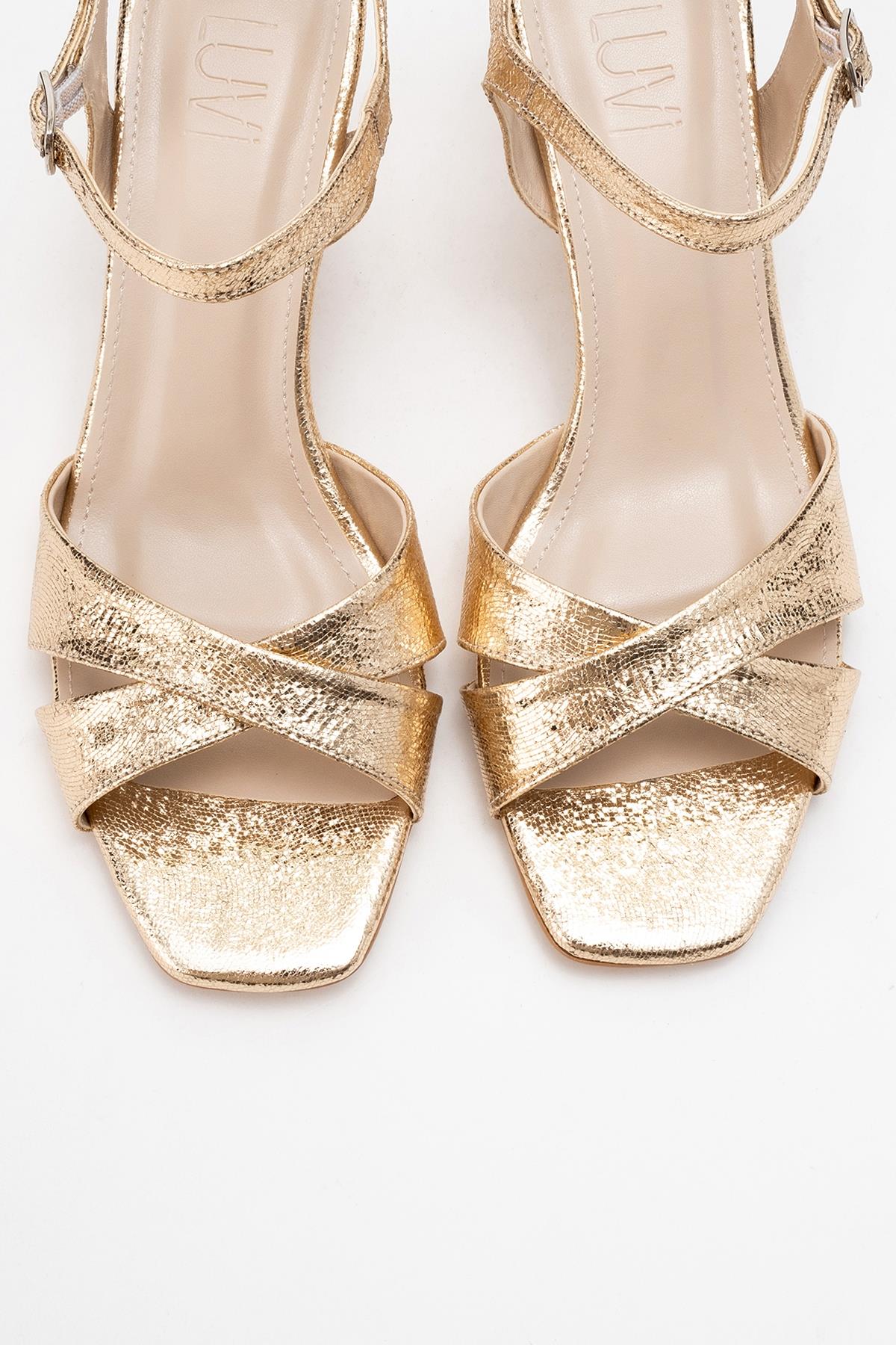 Melin - Gold Patterned Cross-Strap Stiletto Pump – side view showing leather, gold, Vowalisse