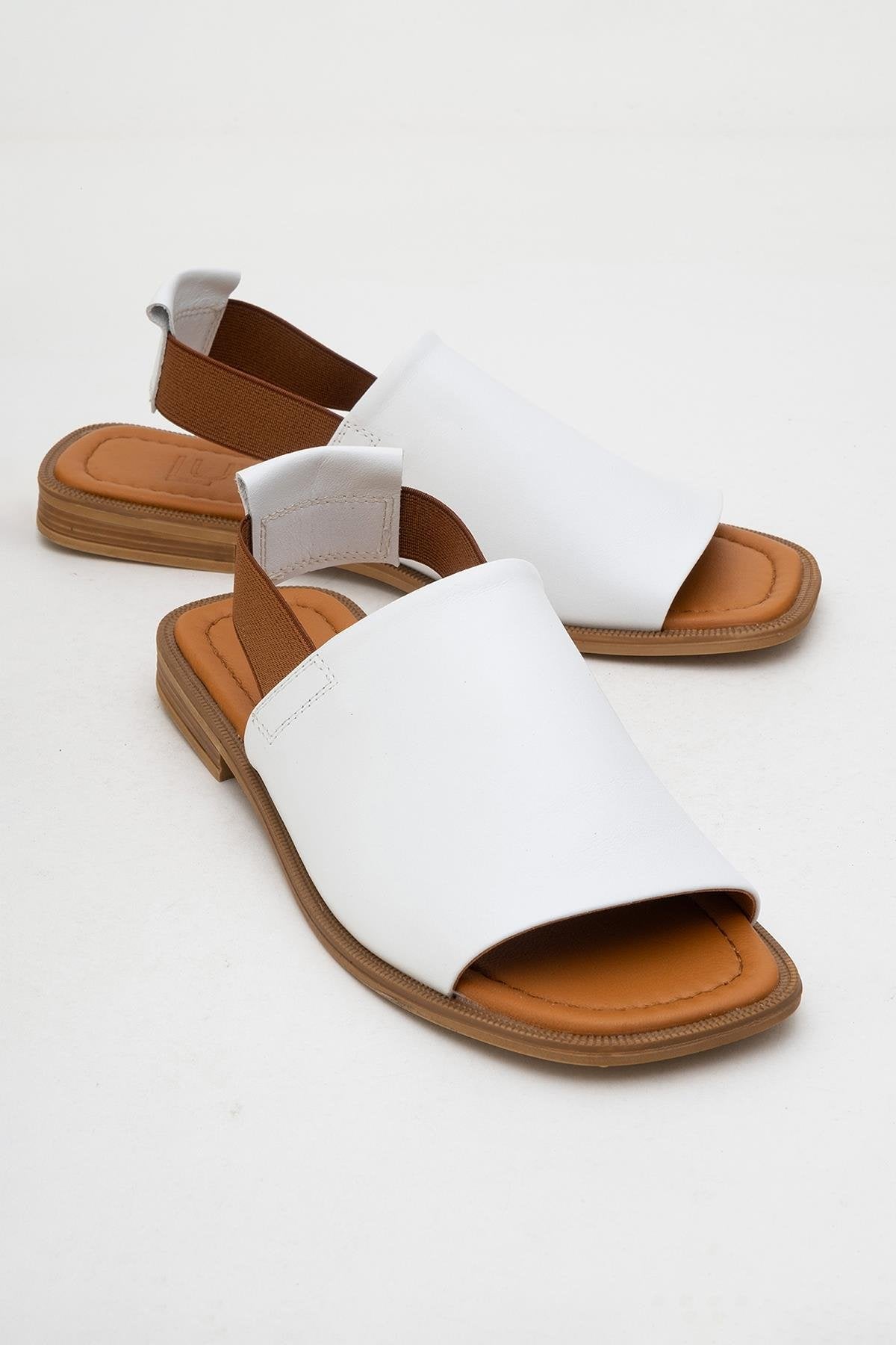 Fuela - White Leather Sandals – front three-quarter view showing leather, white, Vowalisse