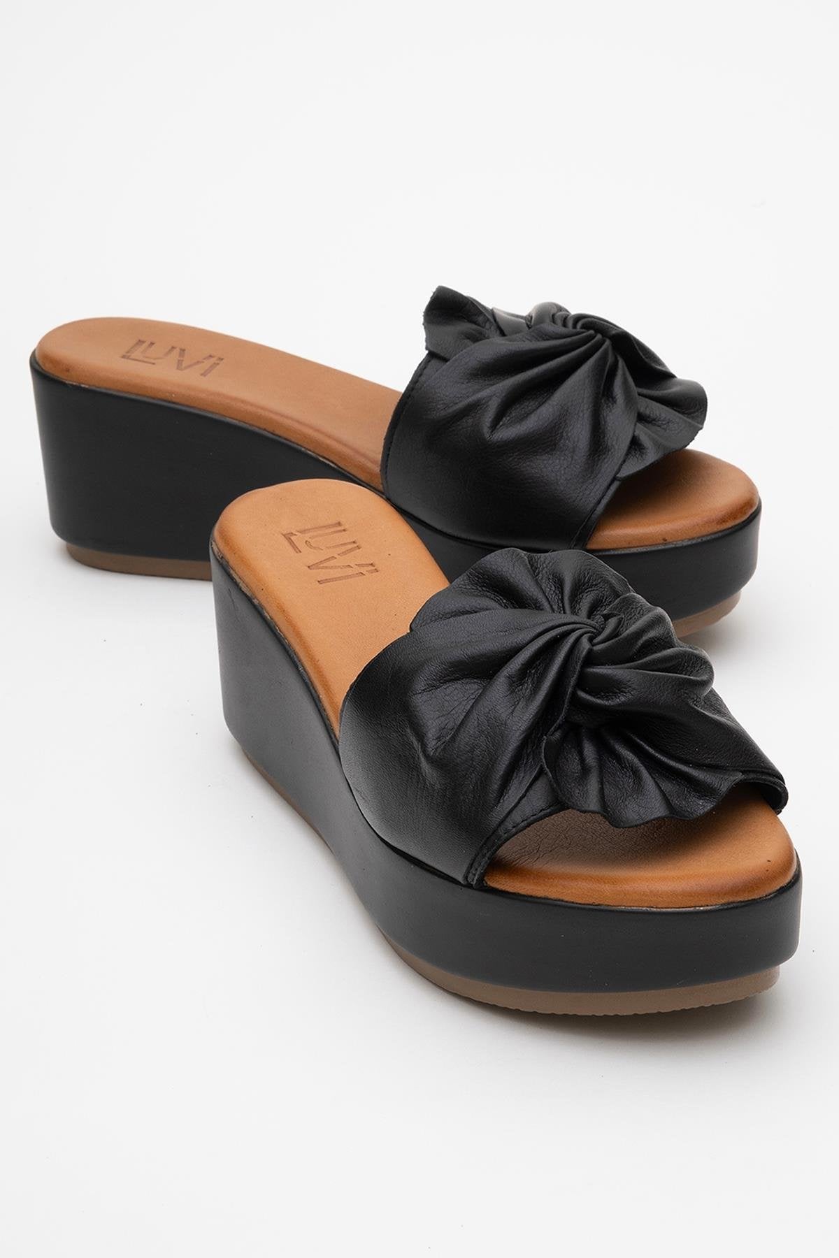 Syndra - Black Bow Wedge Leather Sandal – front three-quarter view showing bow, leather, black, Vowalisse