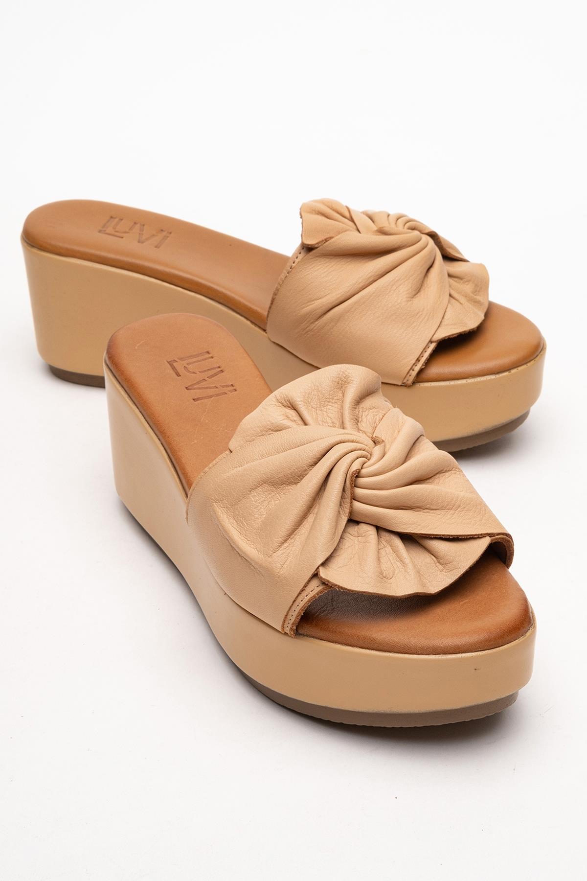 Syndra - Dark Beige Bow Wedge Leather Sandal – front three-quarter view showing bow, leather, Vowalisse