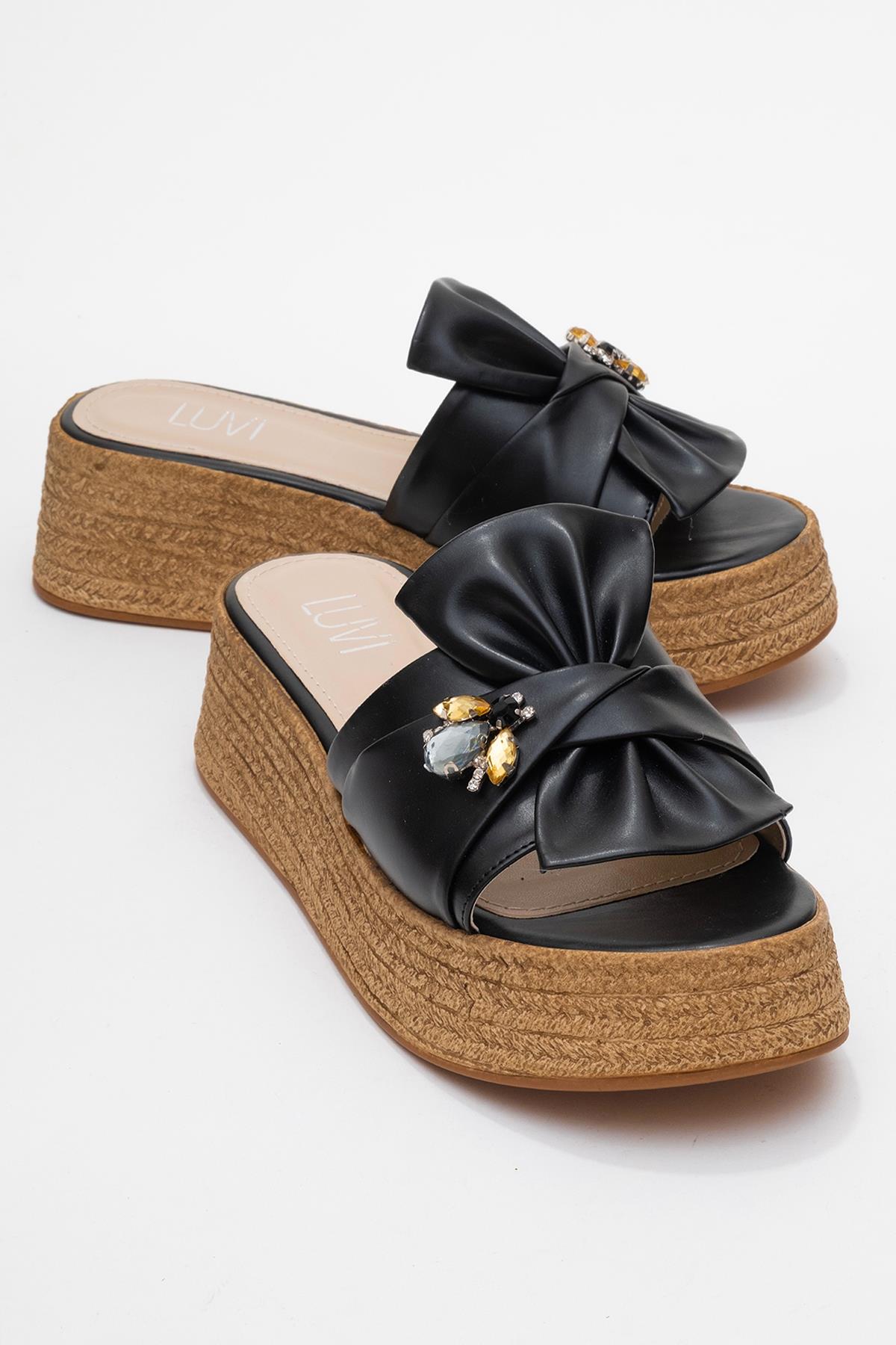 Shara Black Bow & Bee Buckle Platform Sandal – front three-quarter view showing bow, leather, black, Vowalisse