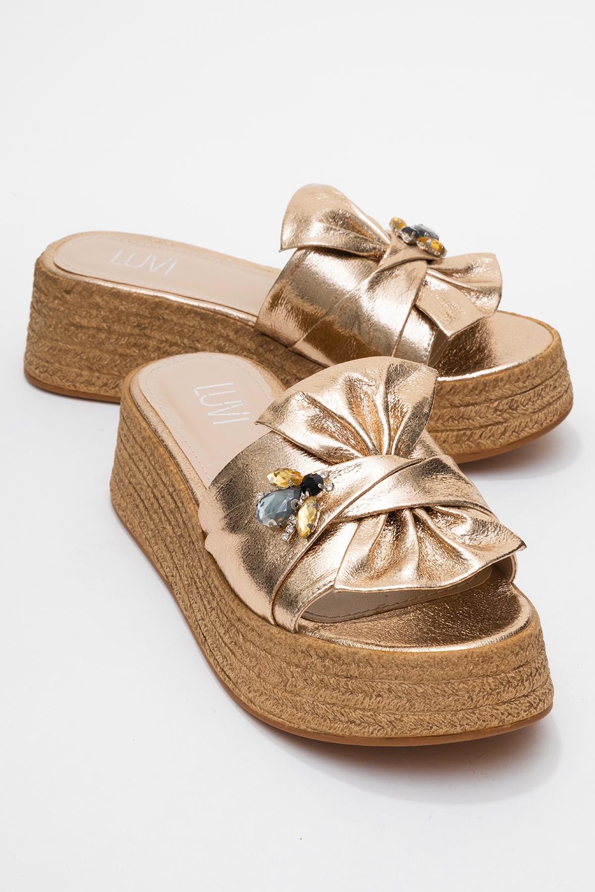 Shara Gold Bow & Bee Buckle Platform Sandal – front three-quarter view showing bow, leather, gold, Vowalisse