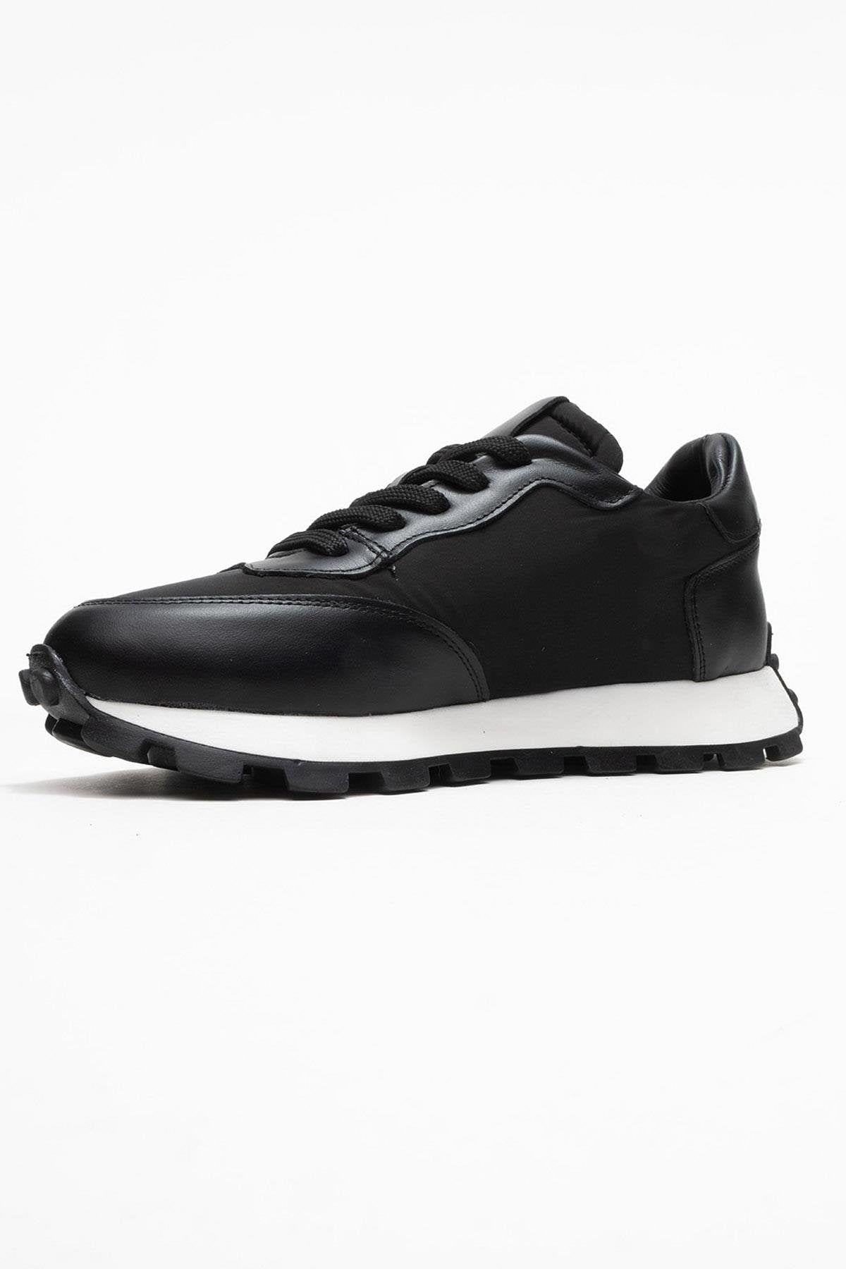 Amanda - Black Genuine Leather Sneaker – heel view showing leather, black, Vowalisse