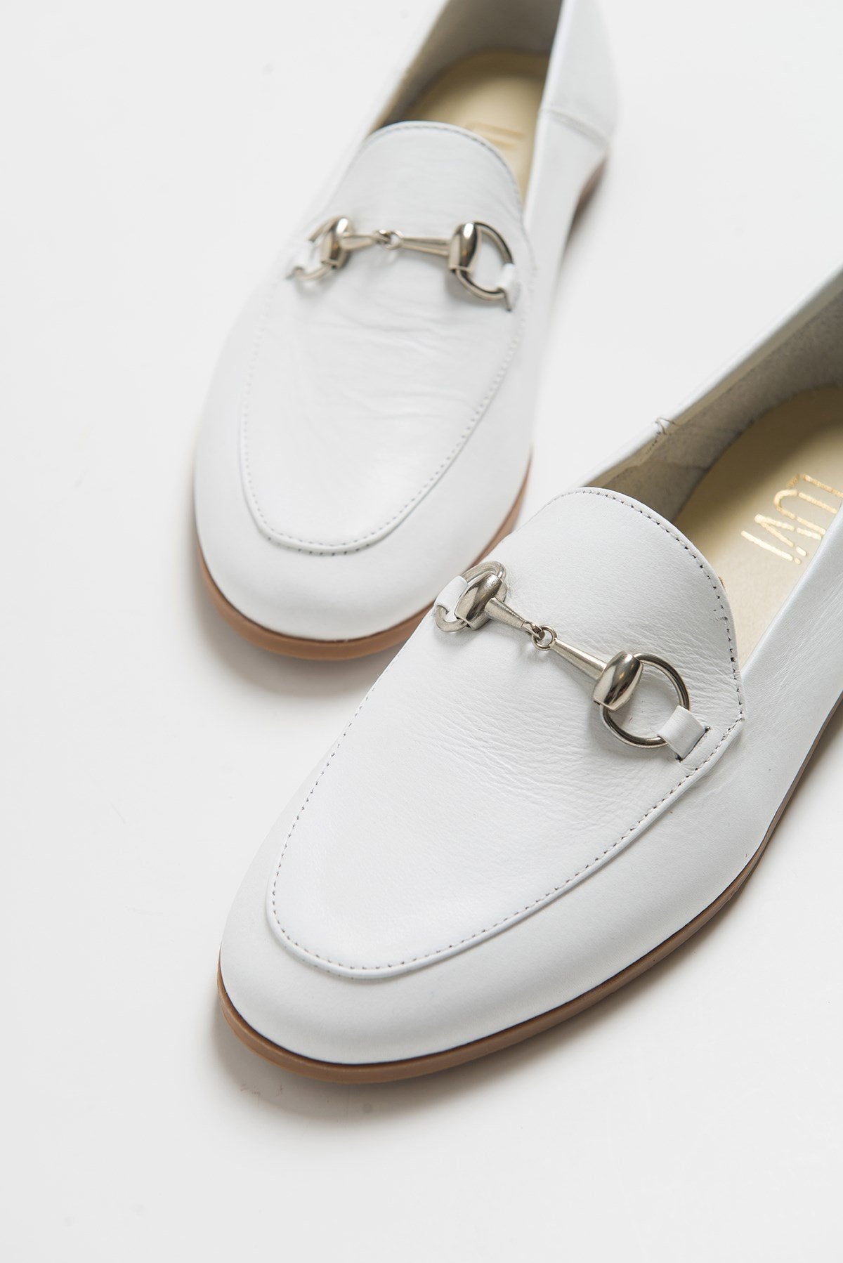 F03 - White Genuine Leather Loafer Shoe – front three-quarter view showing leather, white, Vowalisse