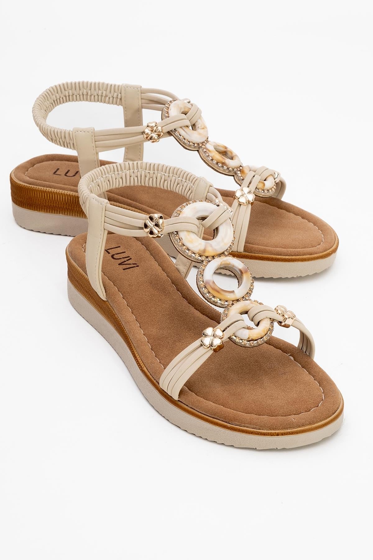 JUNES Beige Buckle-Embellished Flat Sandal – front three-quarter view showing crystal, leather, Vowalisse