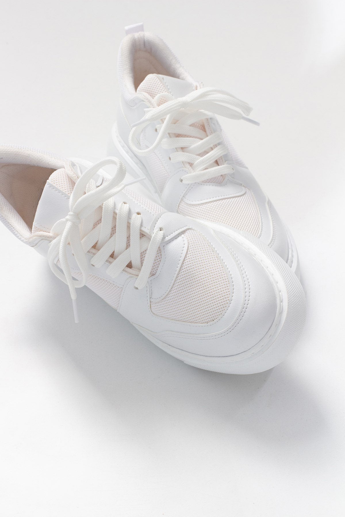 Pure - White Mesh Sneaker – front three-quarter view showing leather, mesh, white, Vowalisse