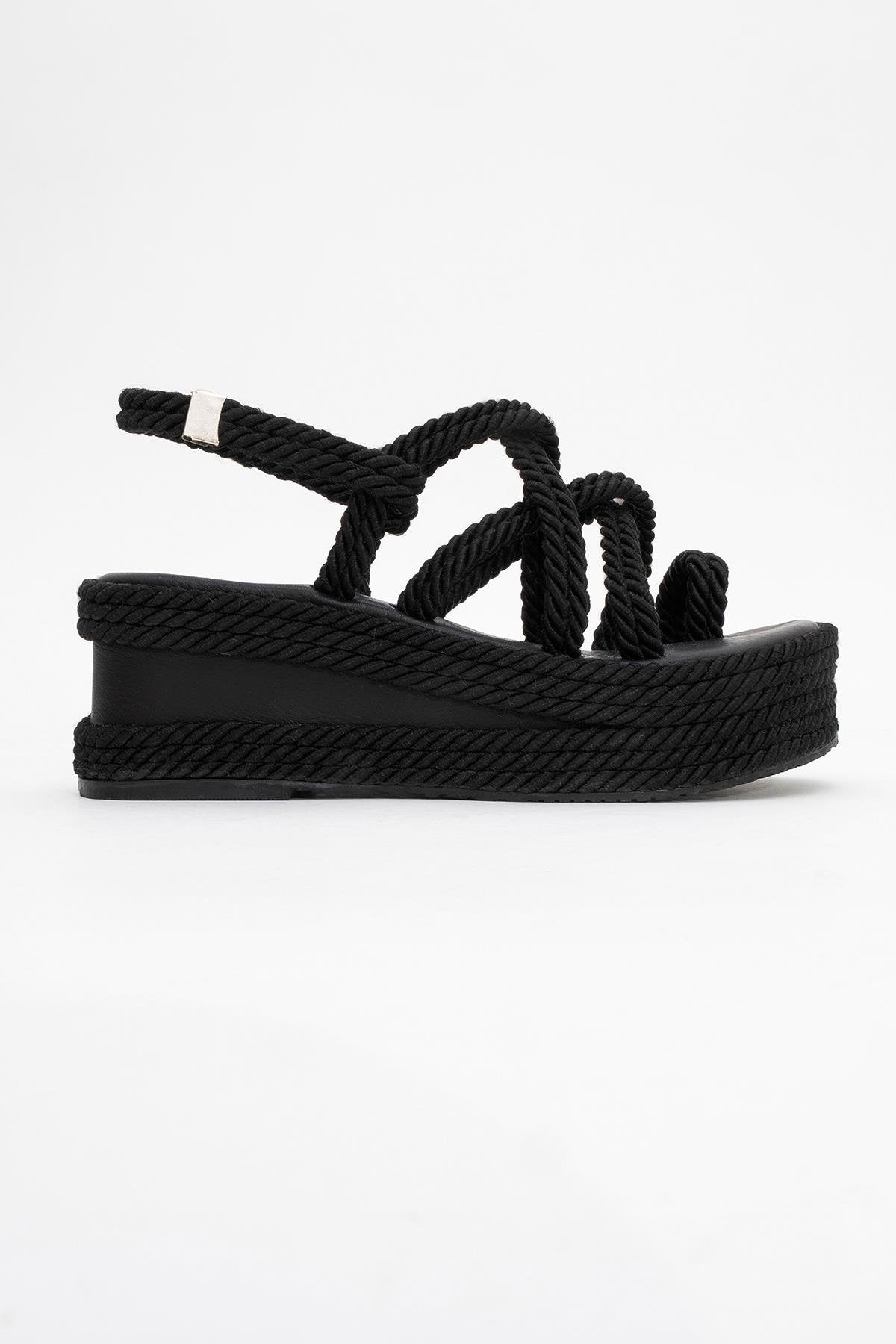 Juney - Black Genuine Leather Lace-Up Wedge Sandal – heel view showing lace, leather, black, Vowalisse
