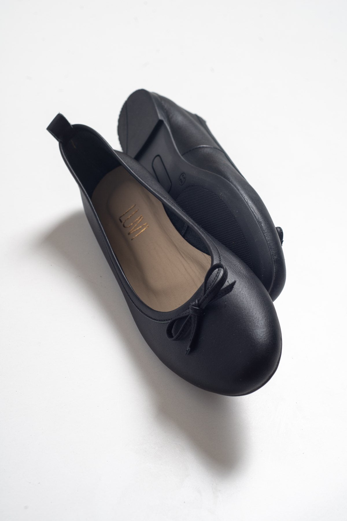 Florence - Black Ballerina Flats – heel view showing bow, leather, suede, Vowalisse