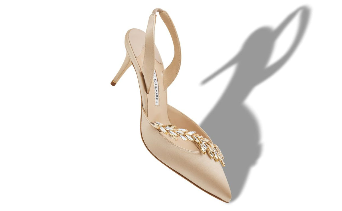 Amelie Pearl Neutral Jewel Buckle Slingbacks – front three-quarter view showing neutral jewel buckle, slingback, pointed…