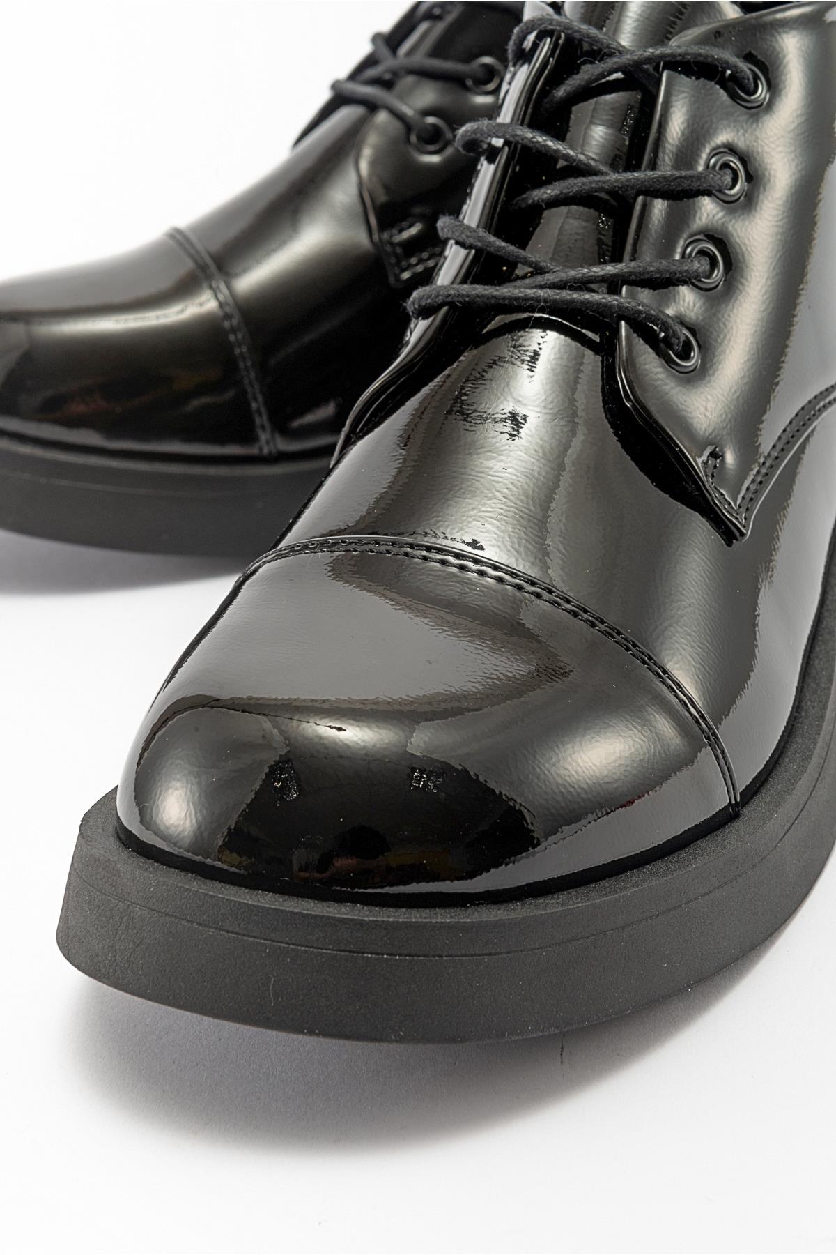 Lagom - Black Patent Boot – detail view showing leather, black, Vowalisse