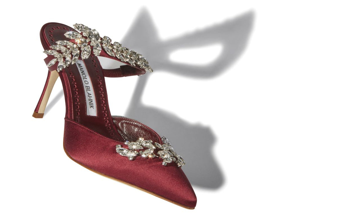 Evangeline Dream Red Crystal Embellished Mules – front three-quarter view showing red crystal embellished, pointed toe…
