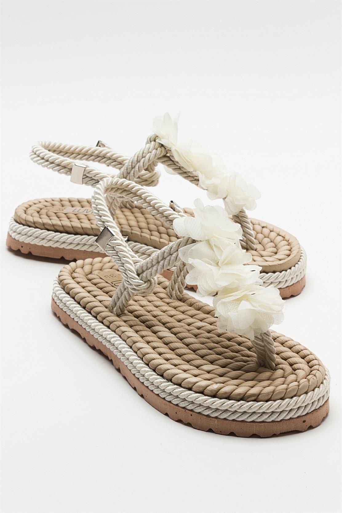 SANTRA Beige Lace-Up Thong Sandals – front three-quarter view showing lace, leather, Vowalisse