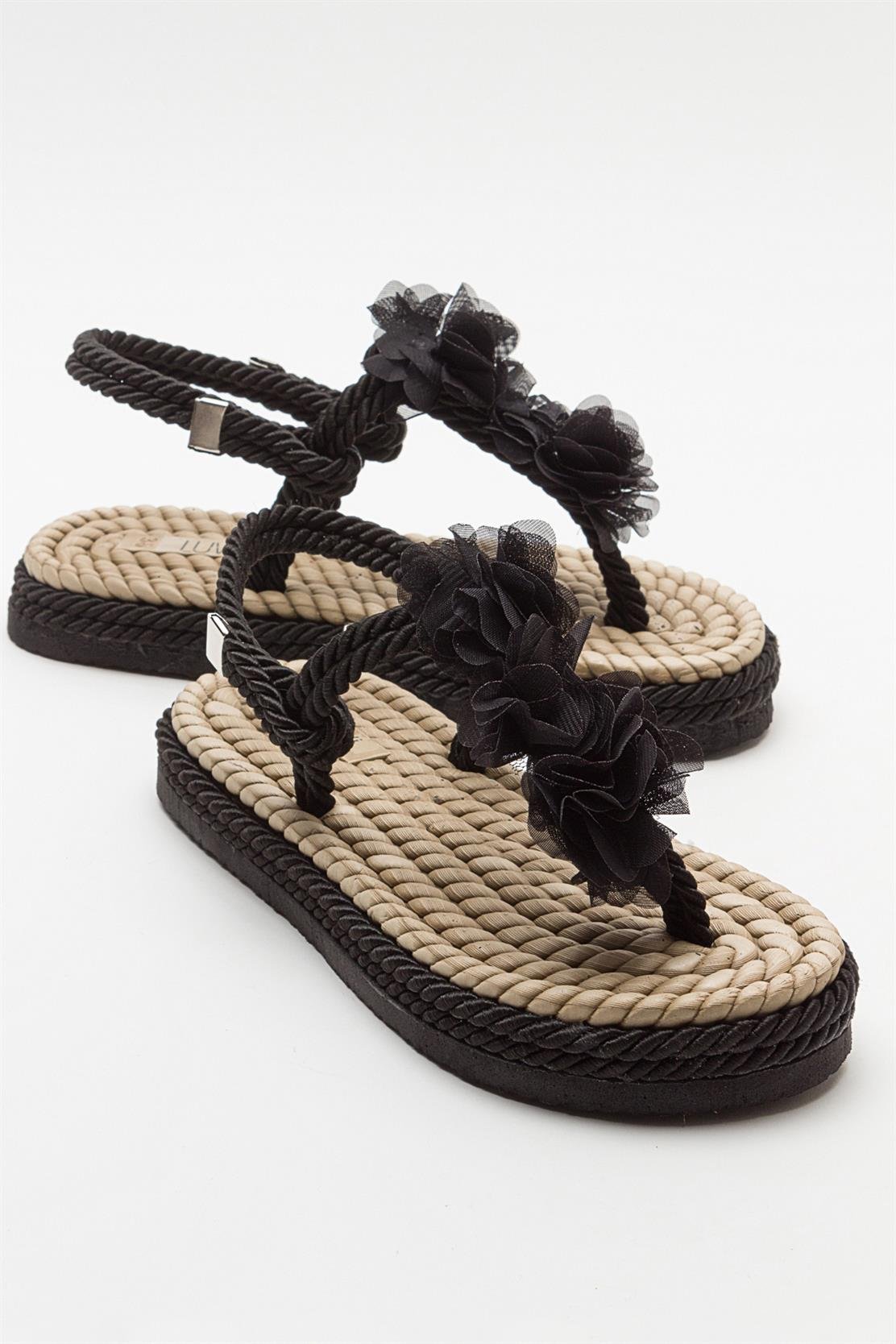 SANTRA Black Lace-Up Thong Sandals – front three-quarter view showing lace, leather, black, Vowalisse