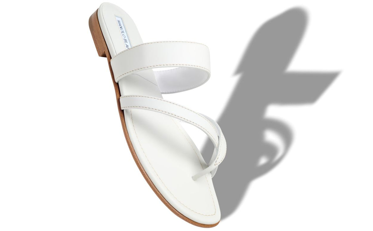 Noelle Shine White Crossover Mules – front three-quarter view showing white crossover, open toe, Vowalisse