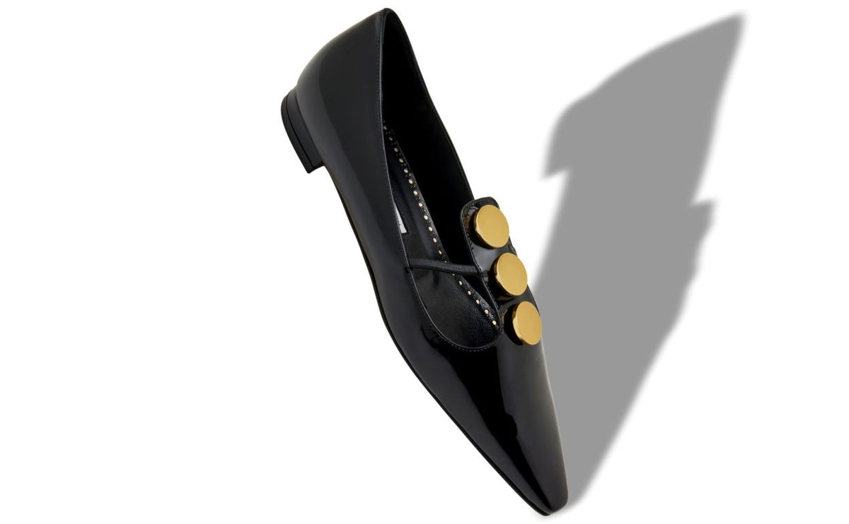 Celeste Shine Black Button Detail T-Bar Shoes – front three-quarter view showing black button detail, almond toe, patent…