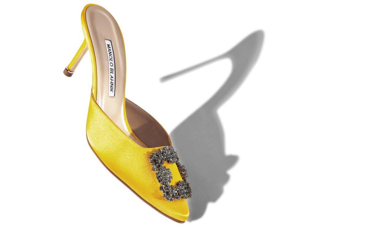 Odette Dawn Yellow Jewel Buckle Mules – front three-quarter view showing yellow jewel buckle, crystal buckle, almond toe…