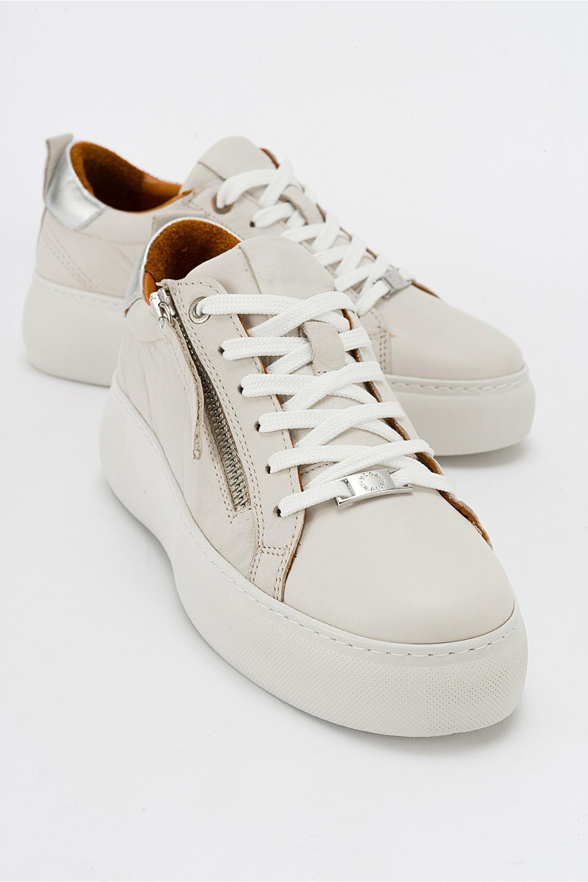 Allie - Beige Leather Zip Sneaker – front three-quarter view showing leather, Vowalisse
