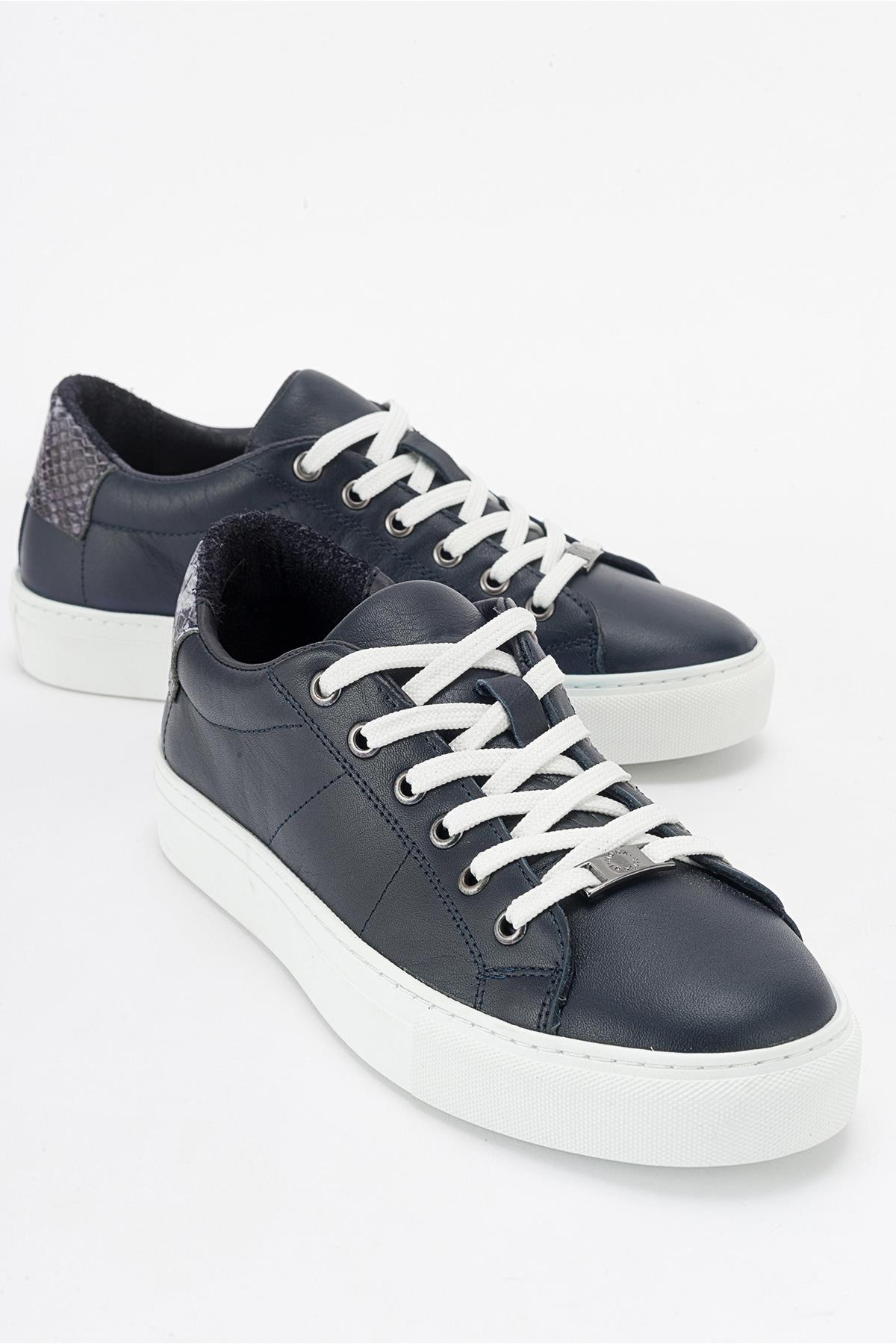 Ayverie - Navy Leather Sneaker – front three-quarter view showing leather, Vowalisse