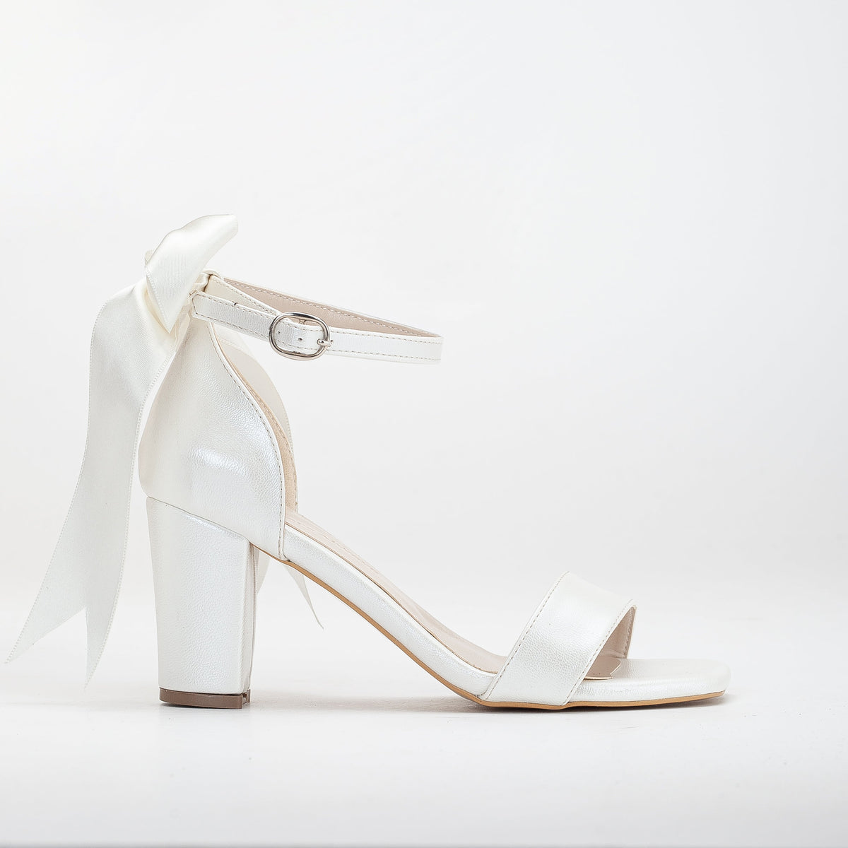 Noelle - Ivory Wedding Sandals with Ribbon – front three-quarter view showing leather, ivory, Vowalisse