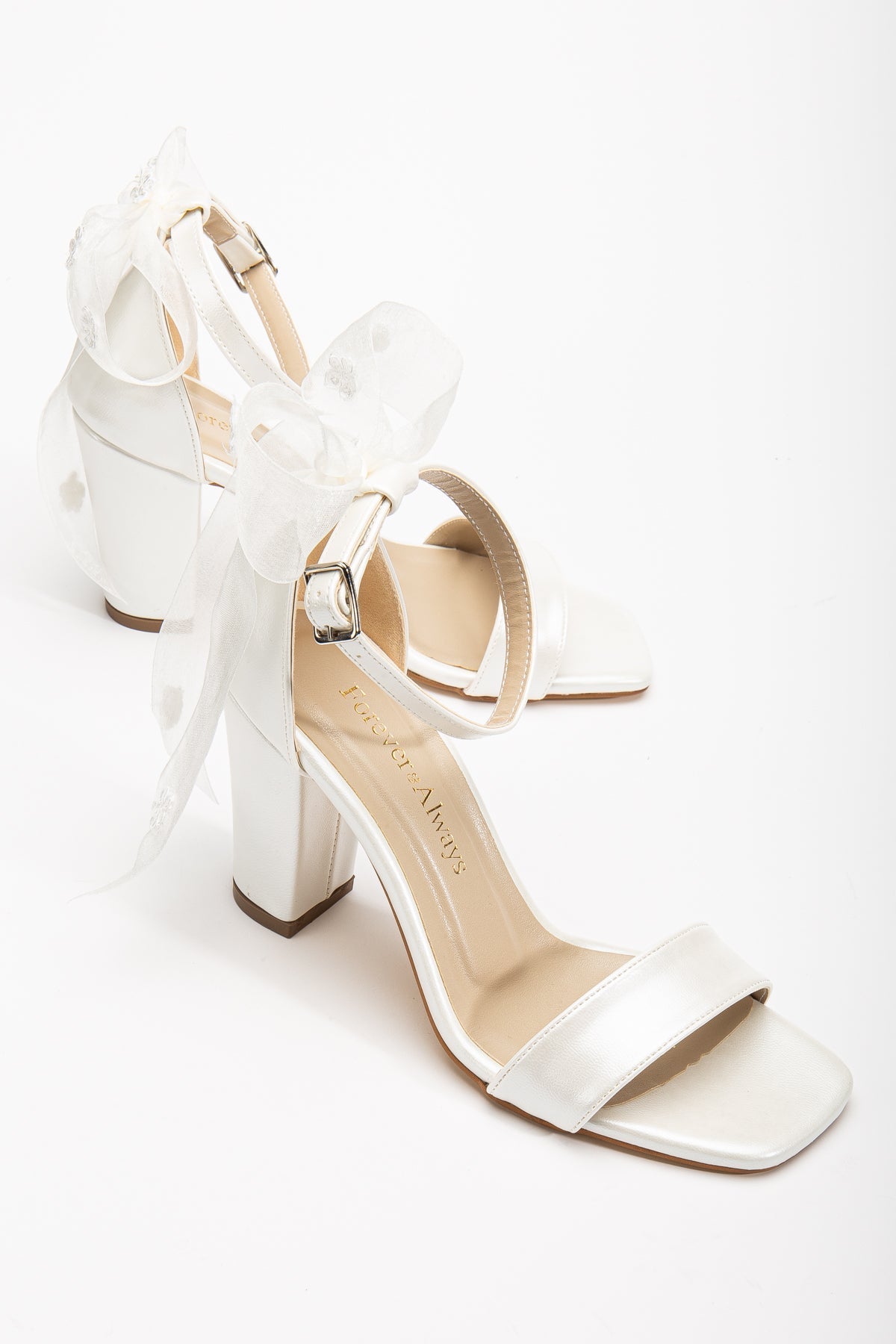Rafaelle - Ivory Wedding Sandals with Ribbon – front three-quarter view showing bow, lace, leather, Vowalisse