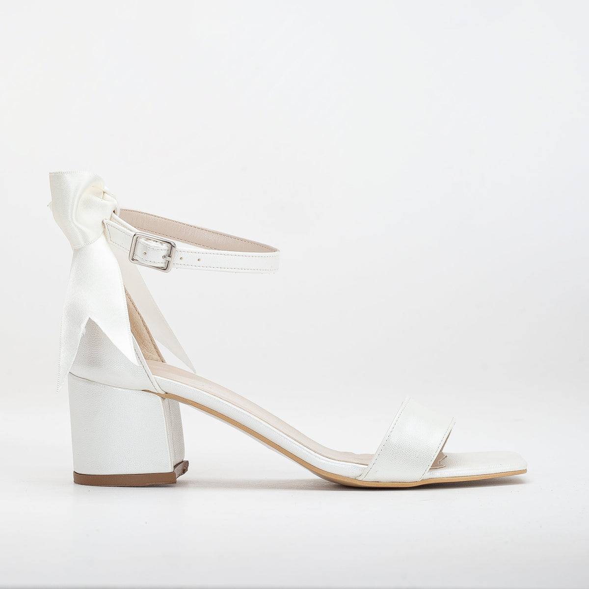 Rochelle - Ivory Bridal Sandals with Ribbon – front three-quarter view showing bow, satin, leather, Vowalisse