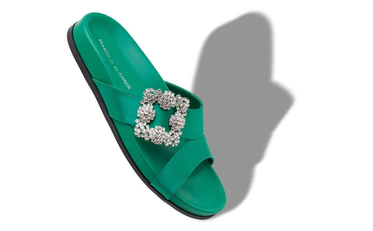 Genevieve Rose Green Jewel Buckle Mules – front three-quarter view showing green jewel buckle, crossover, open toe, satin…