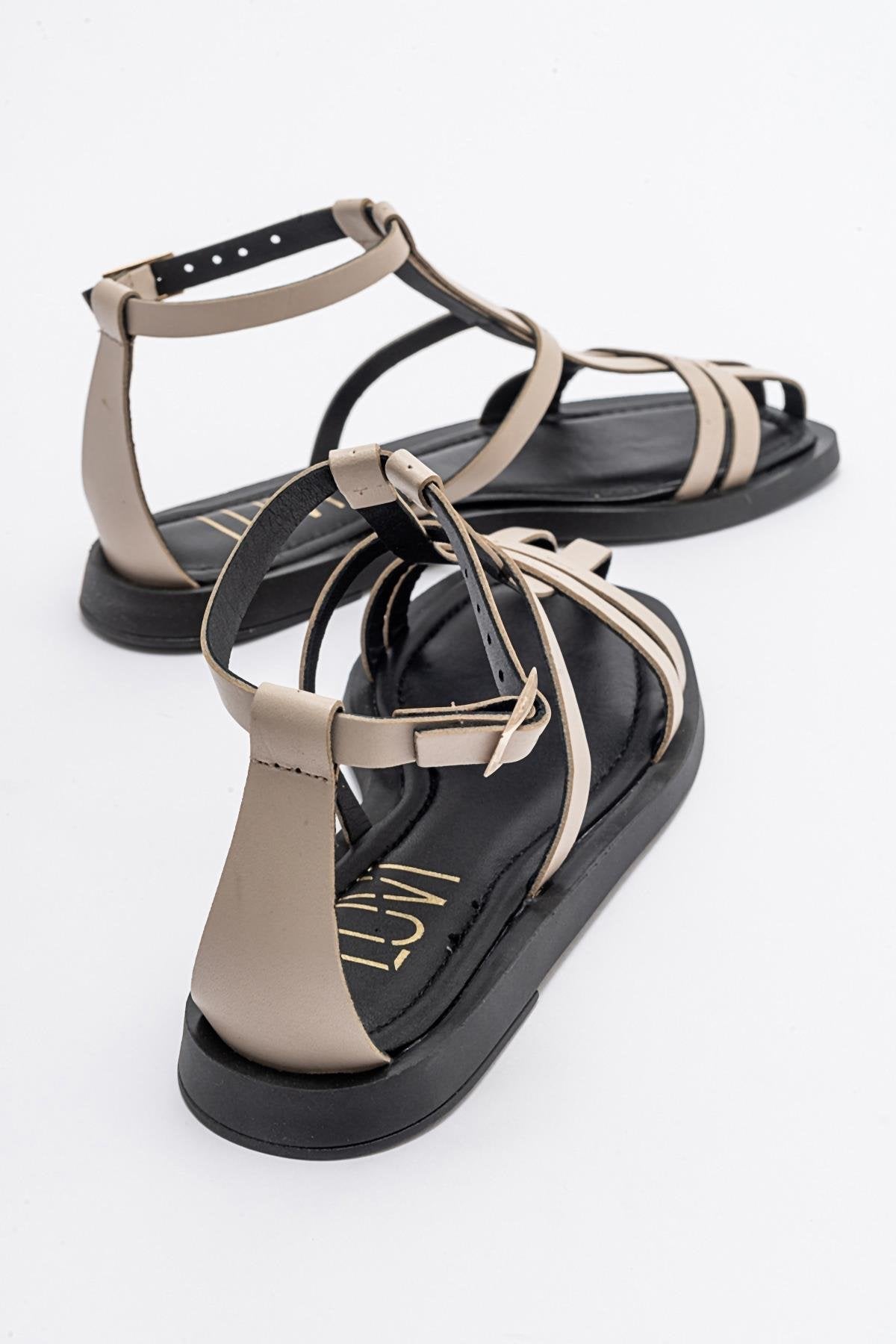 Odeil - Beige Leather Sandal – heel view showing leather, Vowalisse