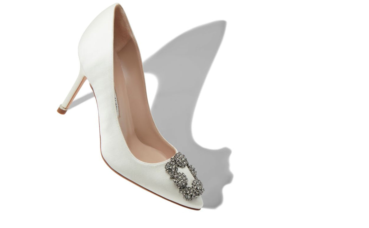 Bianca Élan White Jewel Buckle Pumps – front three-quarter view showing white jewel buckle, crystal buckle, almond toe…