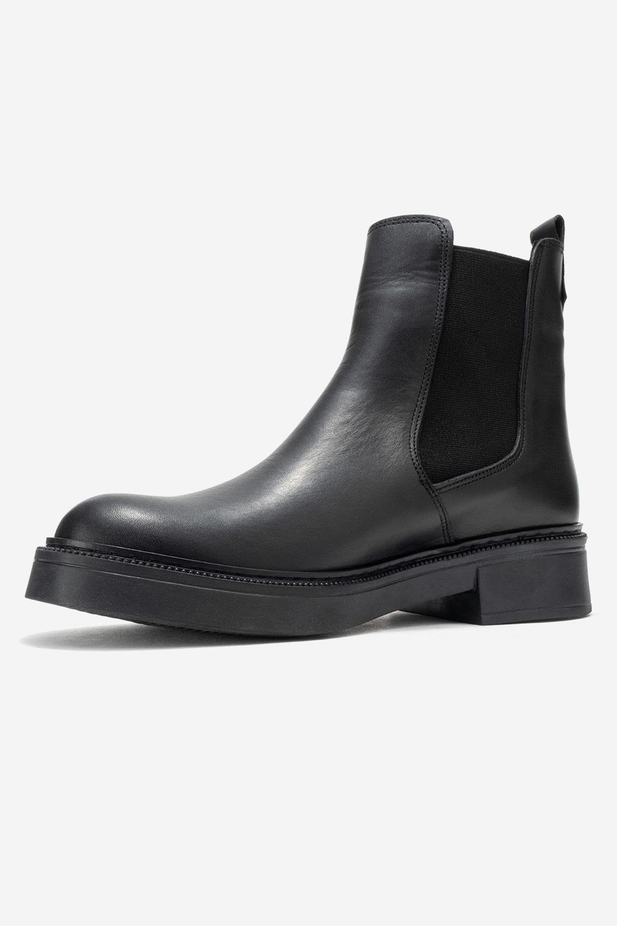 Orliss - Black Genuine Leather Elastic Panel Chelsea Boot – heel view showing leather, black, Vowalisse