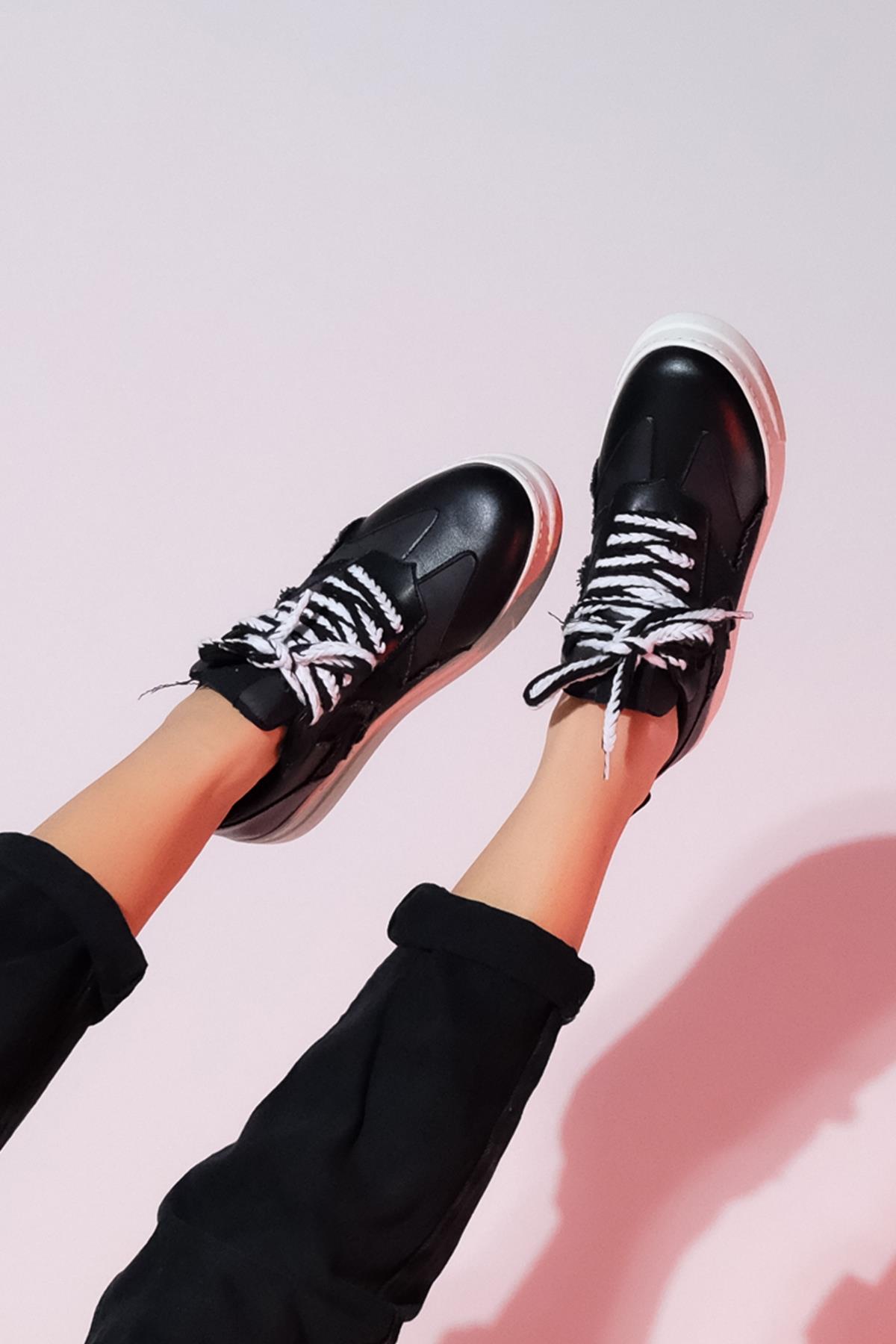 Sande - Black Denim Detail Sport Sneaker – heel view showing leather, black, Vowalisse