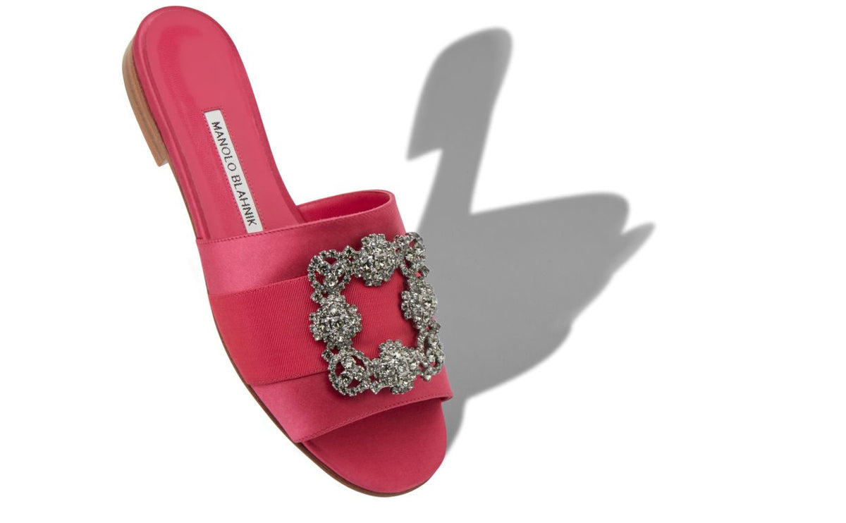 Isadora Shine Pink Jewel Buckle Mules – front three-quarter view showing pink jewel buckle, crystal buckle, satin…