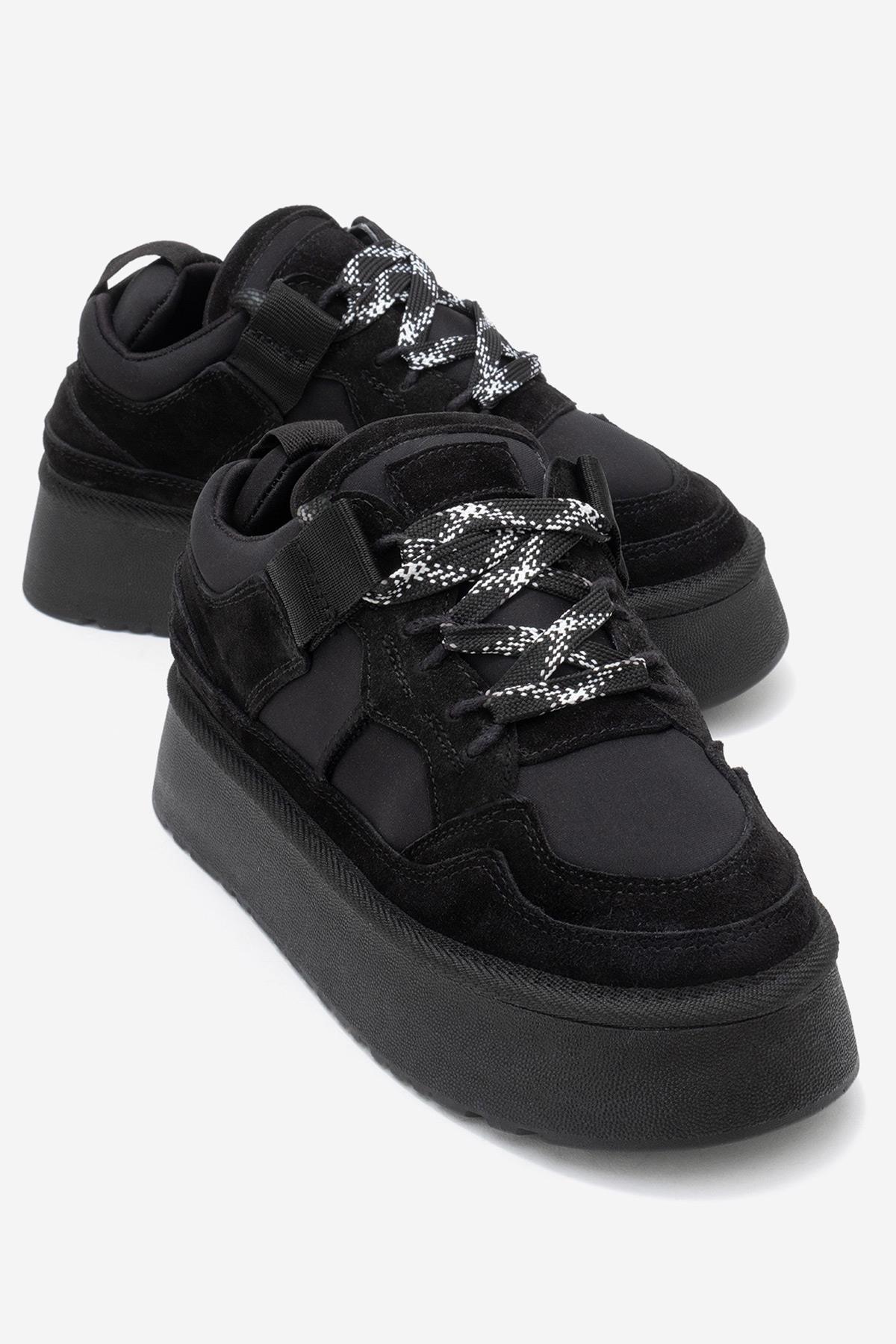 Riven - Black Genuine Leather Platform Sneaker – front three-quarter view showing leather, suede, black, Vowalisse