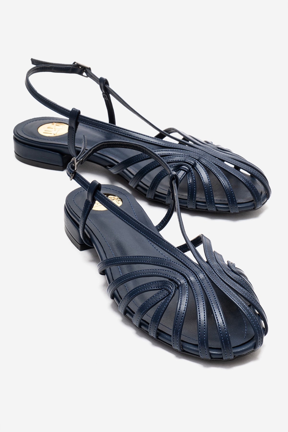 LISS - Navy Sandal – front three-quarter view showing leather, Vowalisse