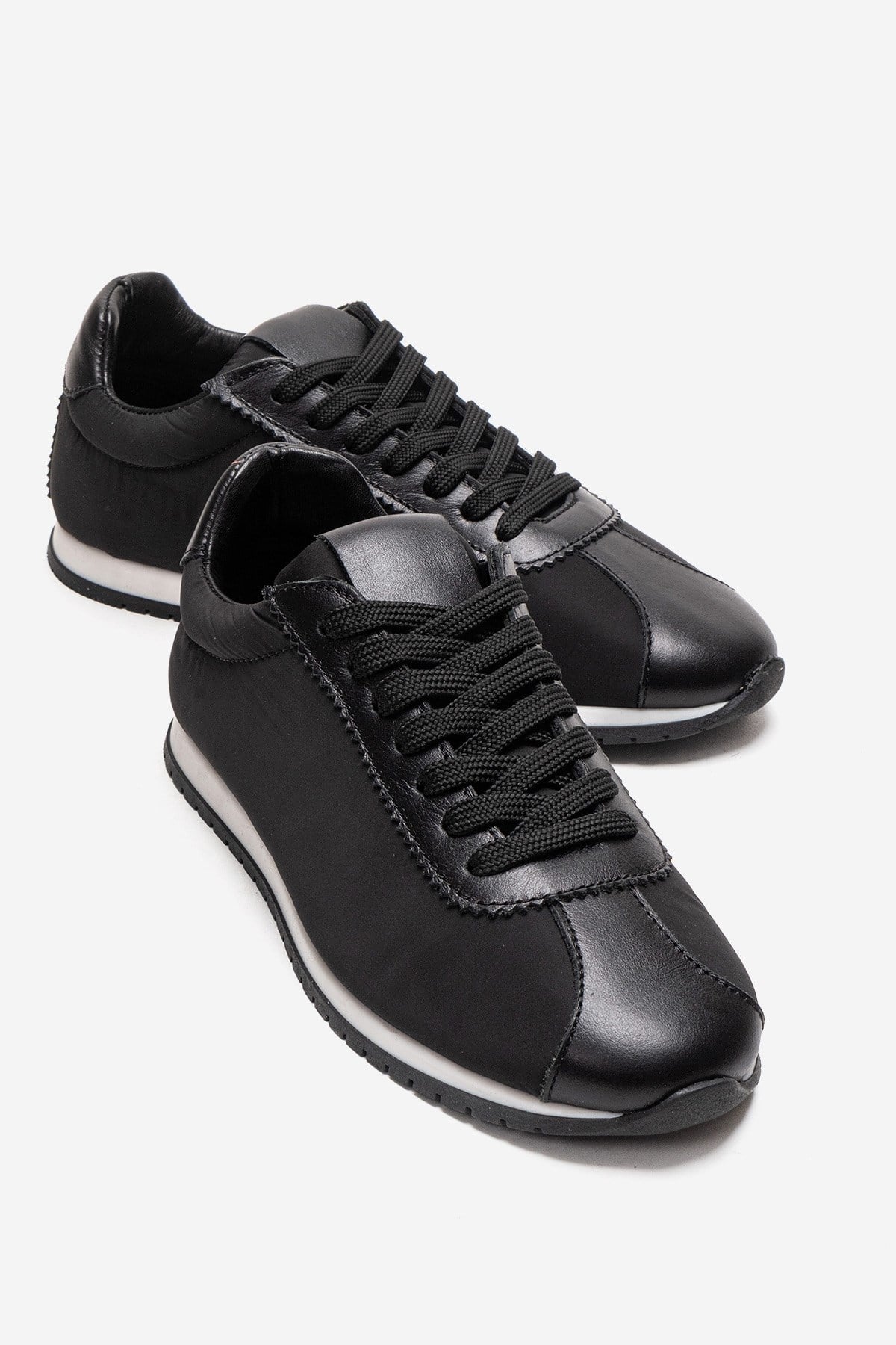UNICA - Black Genuine Leather Sport Shoe – front three-quarter view showing leather, suede, black, Vowalisse