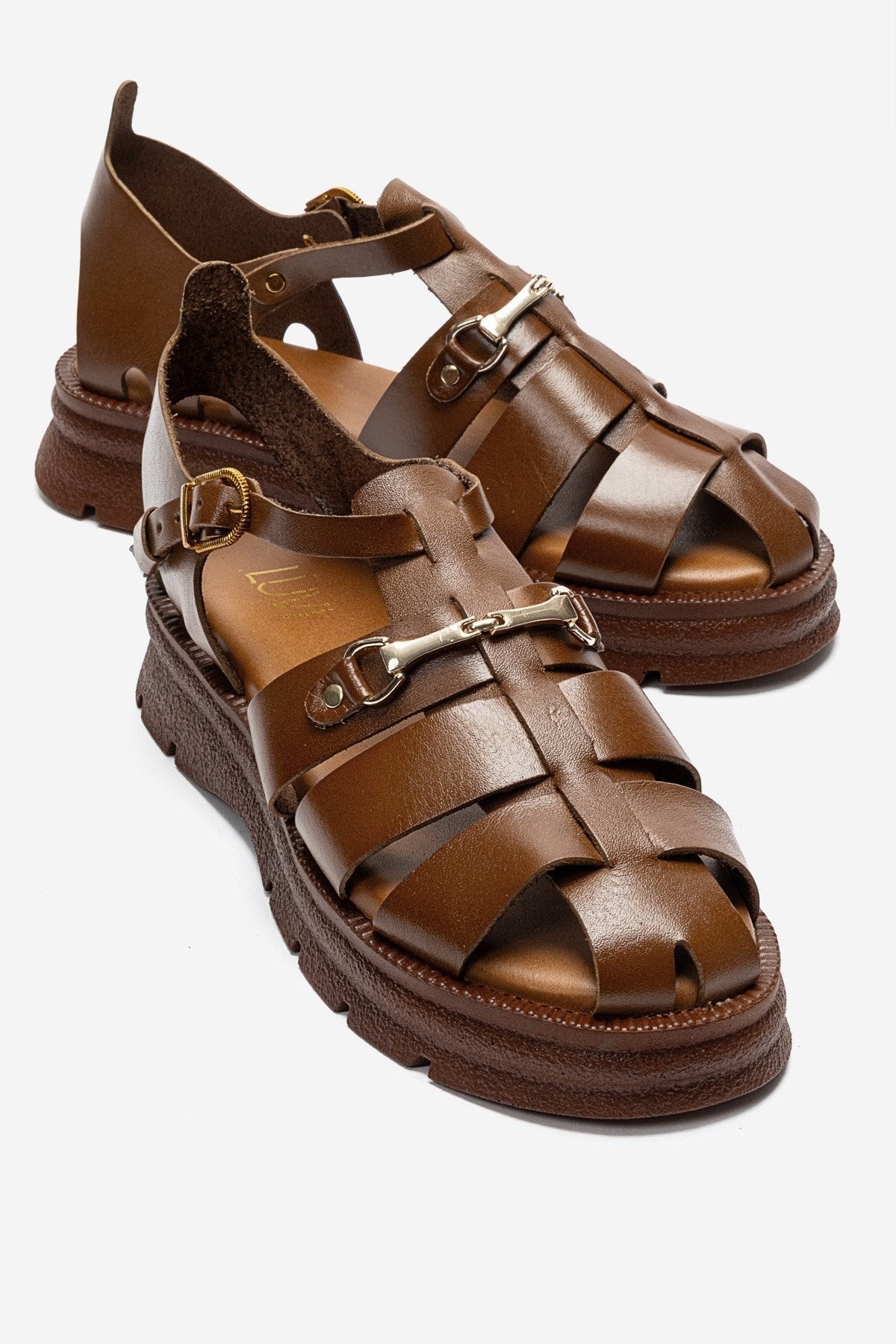 RIELA - Cognac Genuine Leather Buckled Sandal – front three-quarter view showing leather, Vowalisse
