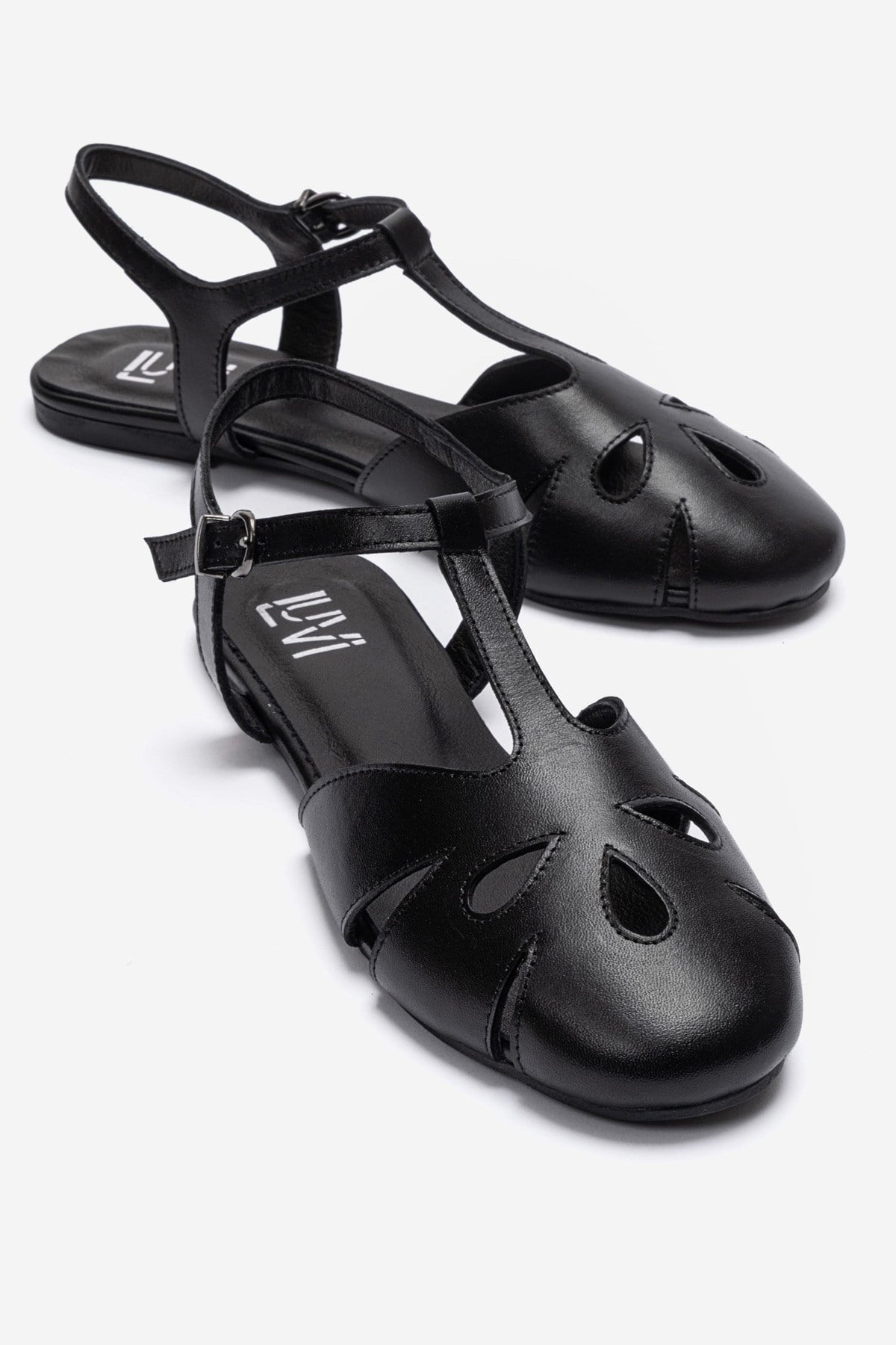 NATHALIE - Black Genuine Leather Ankle-Strap Flat Sandal – front three-quarter view showing leather, black, Vowalisse