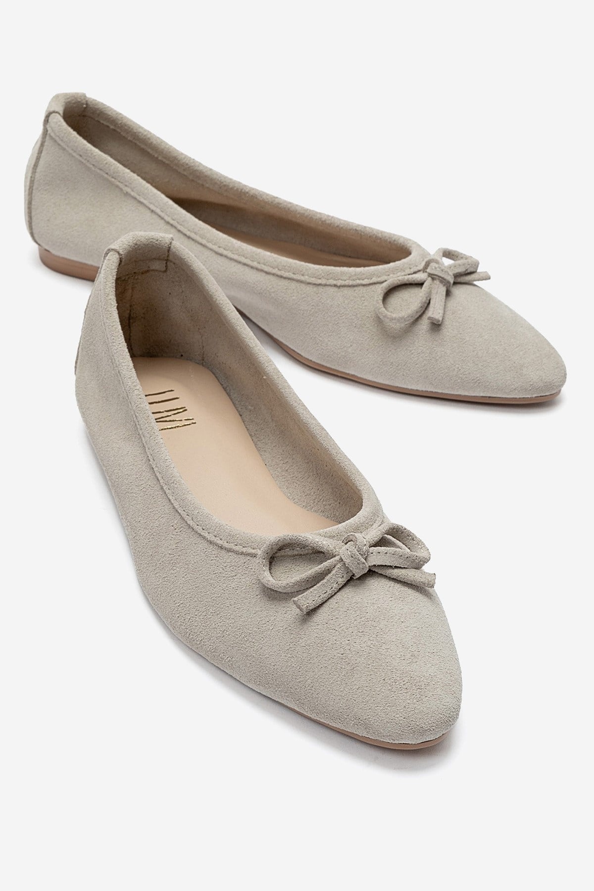 UMIEL - Beige Genuine Leather Bow Ballet Flat – front three-quarter view showing bow, leather, suede, Vowalisse